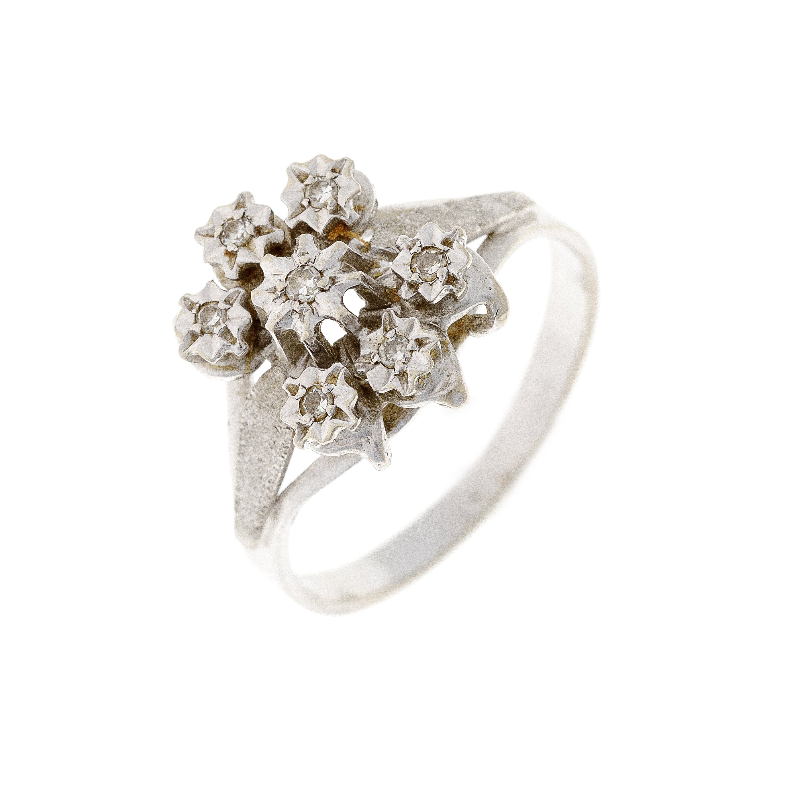 Profile view of the estate floral cluster ring, showcasing its elevated diamond setting and the intricate detailing of the white gold band.