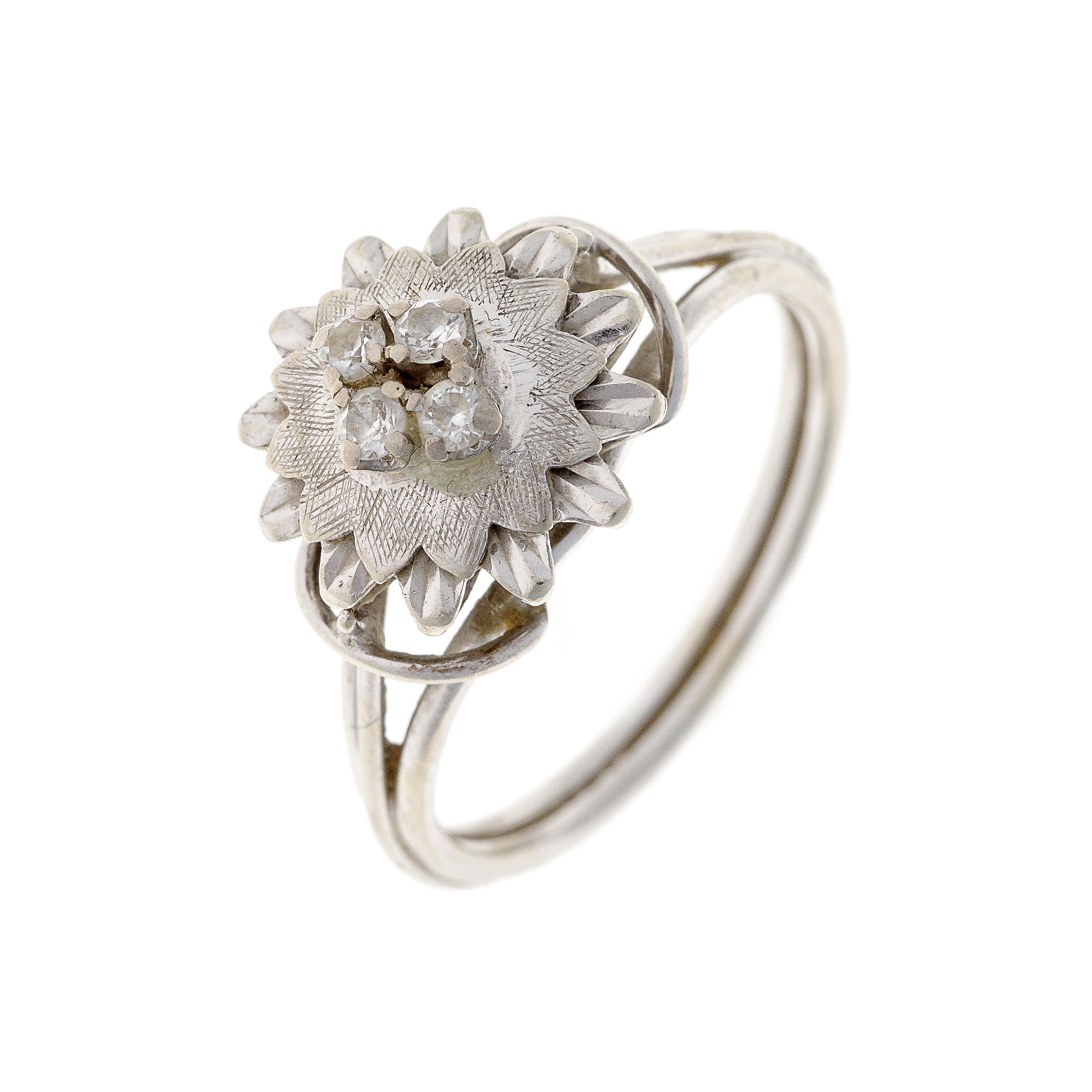 Angled side view of the estate flower ring, showcasing its sculpted goldwork and cubic zirconia petal setting.