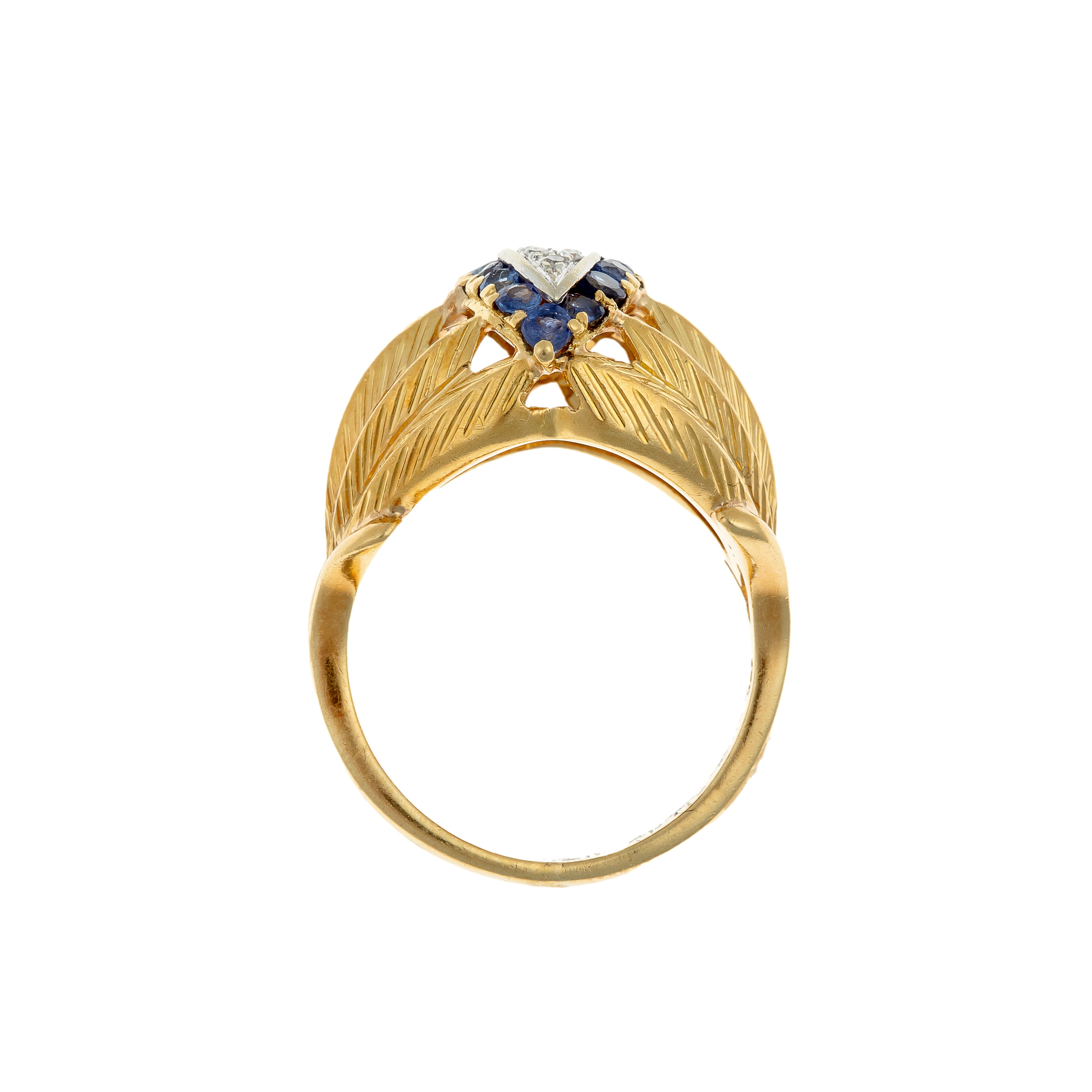 Profile of the Retro-era ring, revealing the openwork gallery and structured craftsmanship.