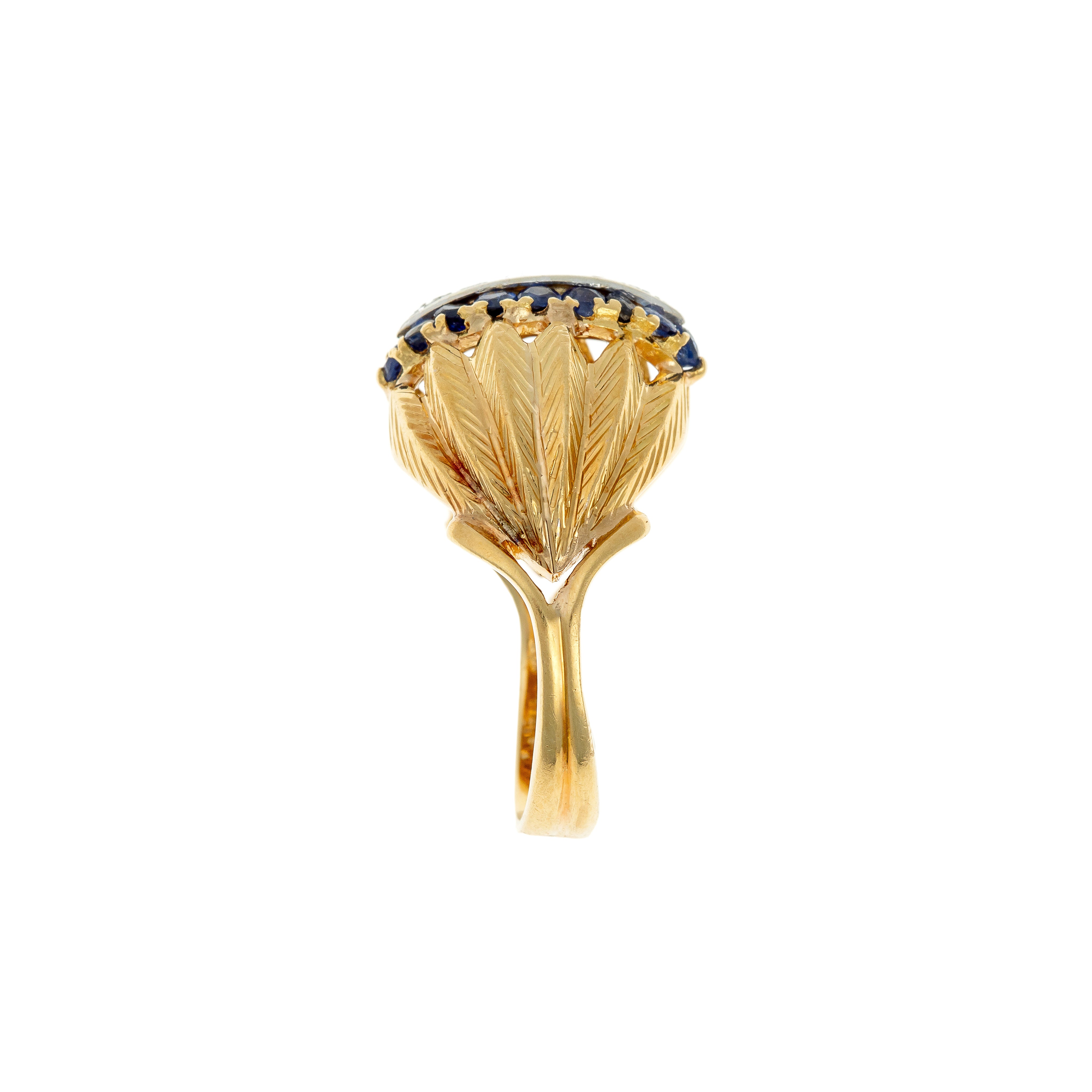Side profile of the 1950s statement ring, highlighting the sculptural engraved goldwork and elevated setting.