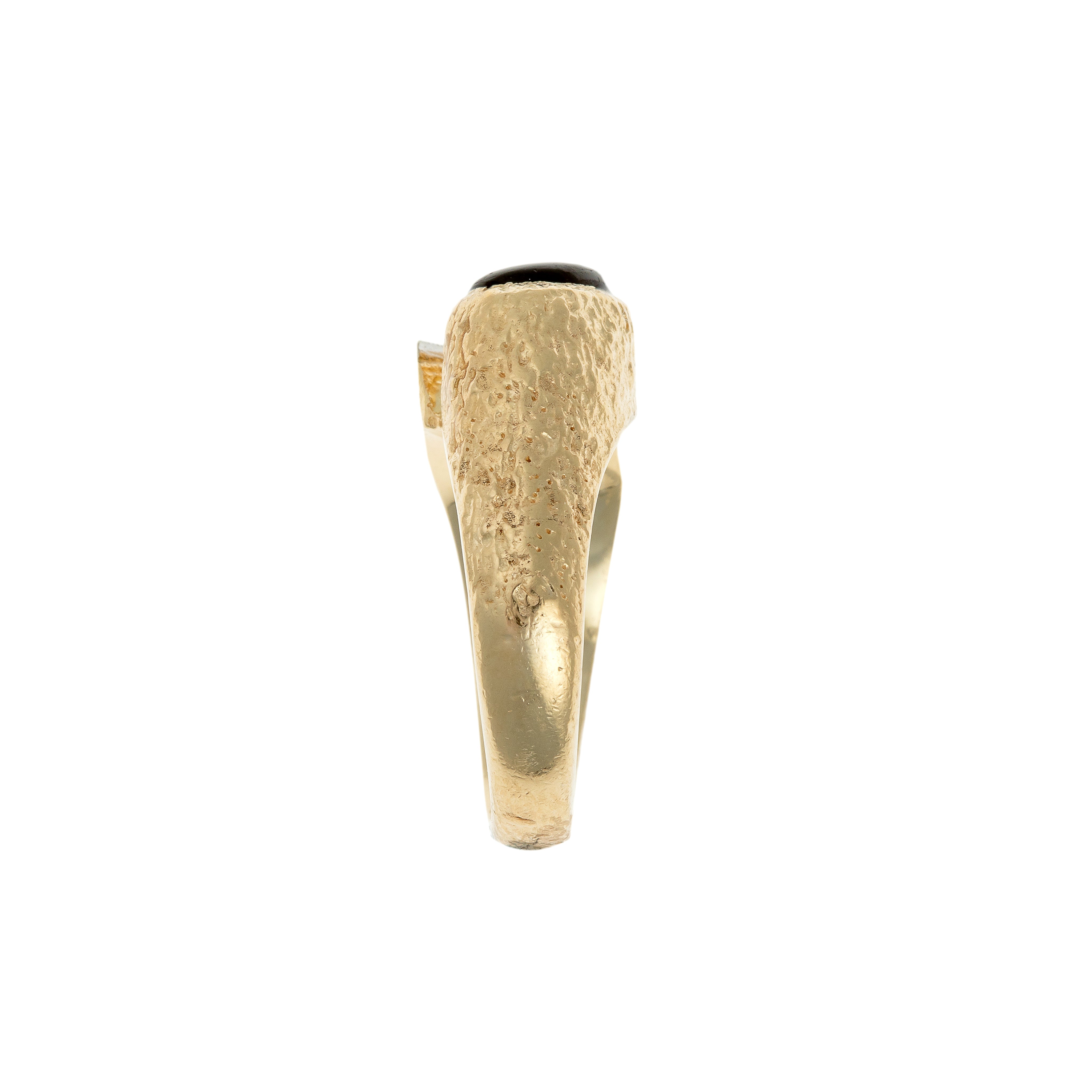 Side view of a German avant-garde ring showcasing its textured gold details.