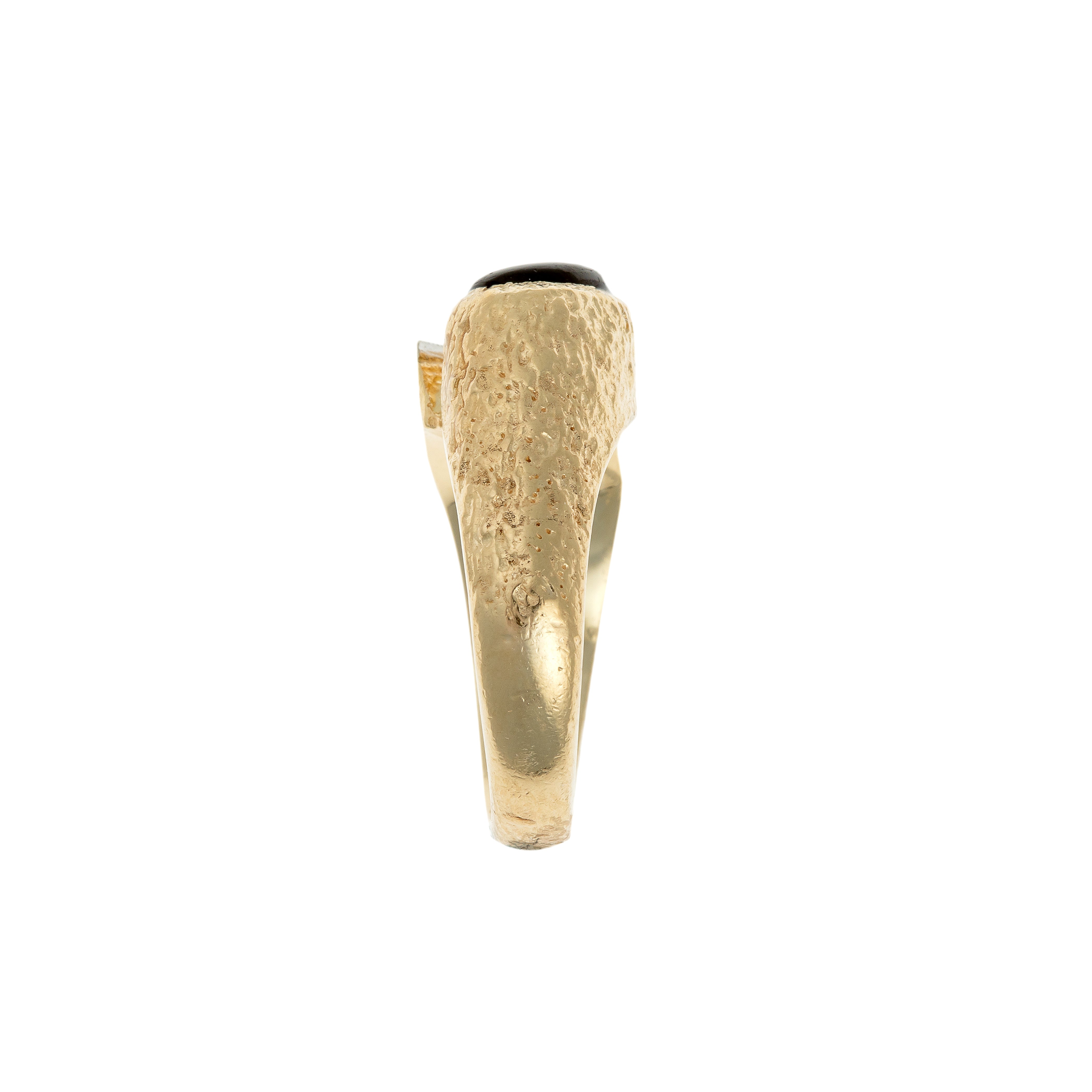 Side view of a German avant-garde ring showcasing its textured gold details.
