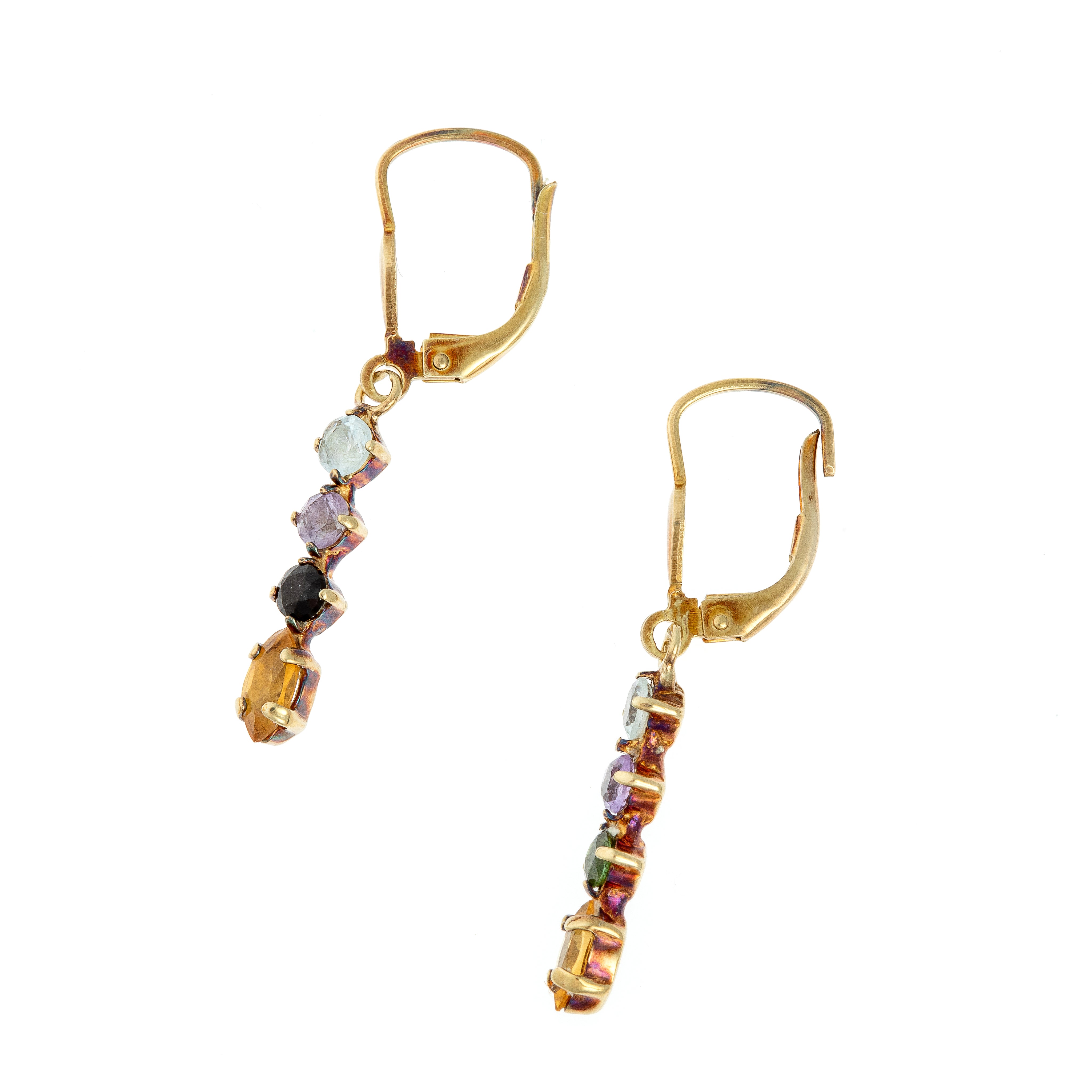 Side view of gold drop earrings with marquise citrines and round amethysts, showing the prong-set gemstone design.