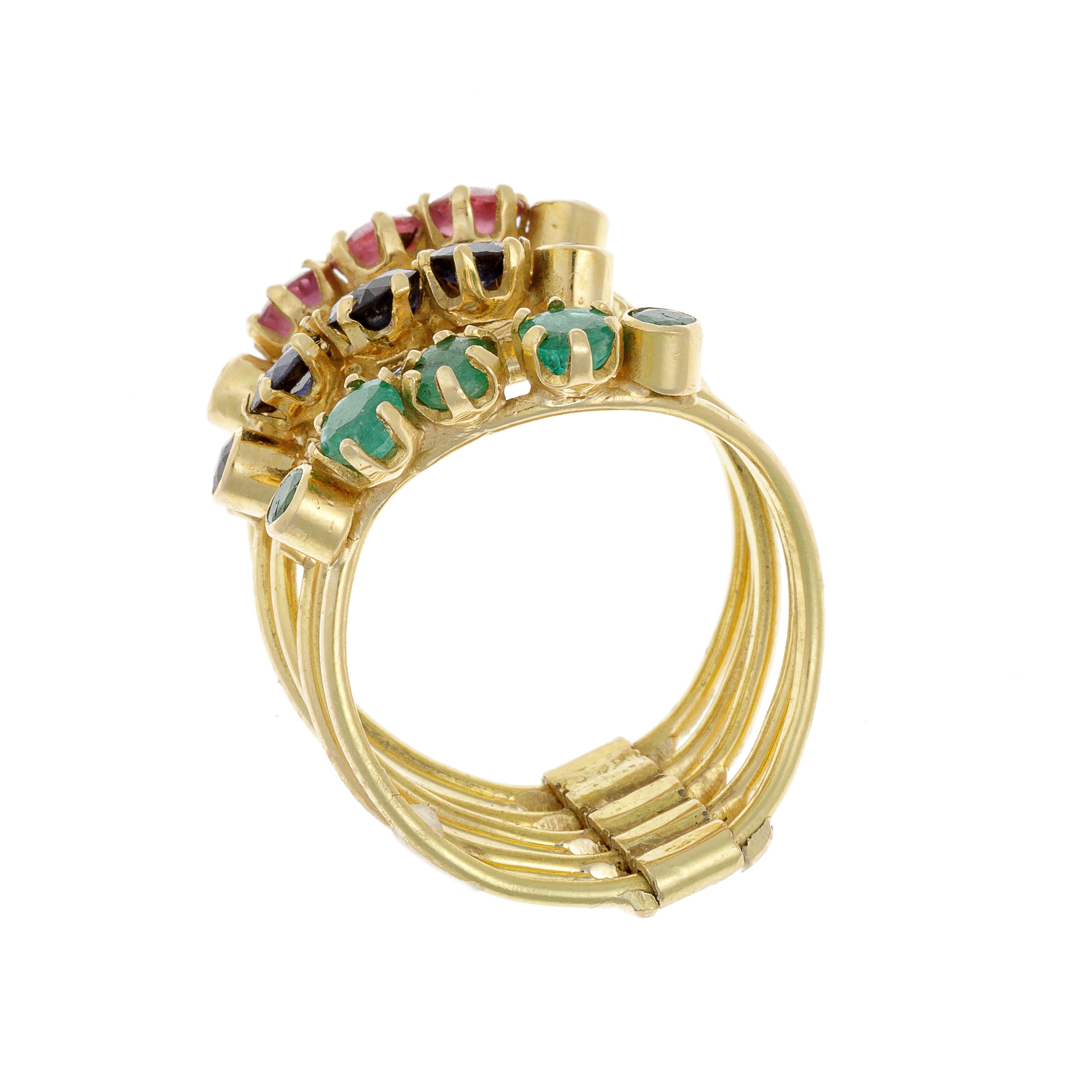 Side profile of gold multi-band ring emphasizing gemstone arrangement and band curvature.