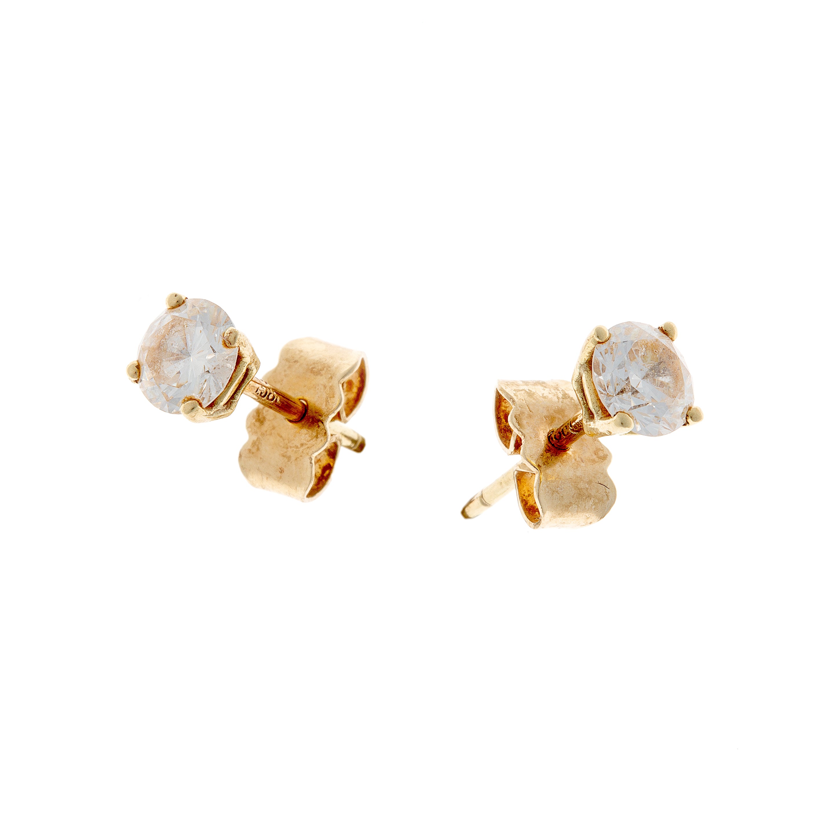 A balanced display of the diamond earrings, highlighting their brilliance and classic design.
