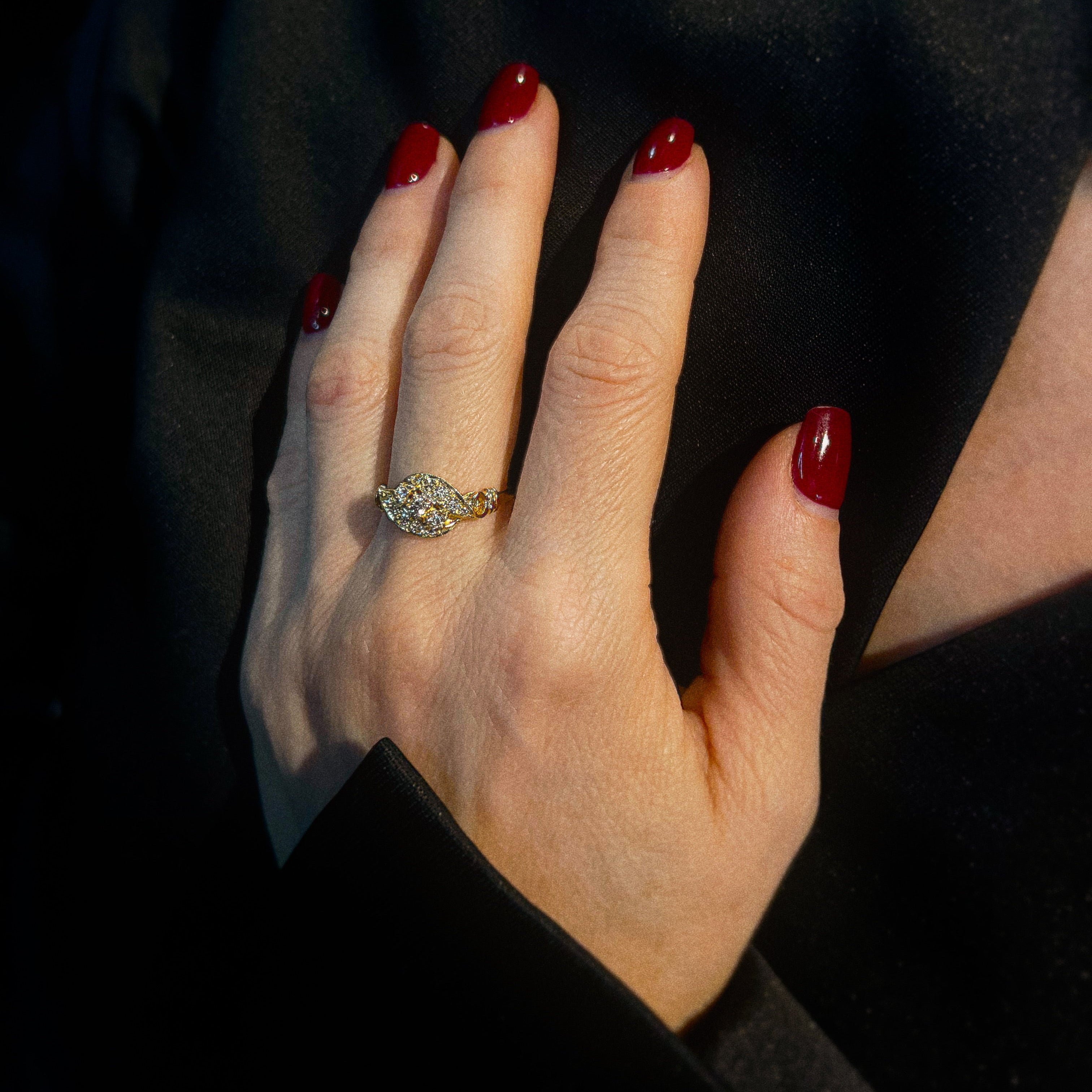 Model wearing the mid-century gold  diamond crossover cocktail ring.