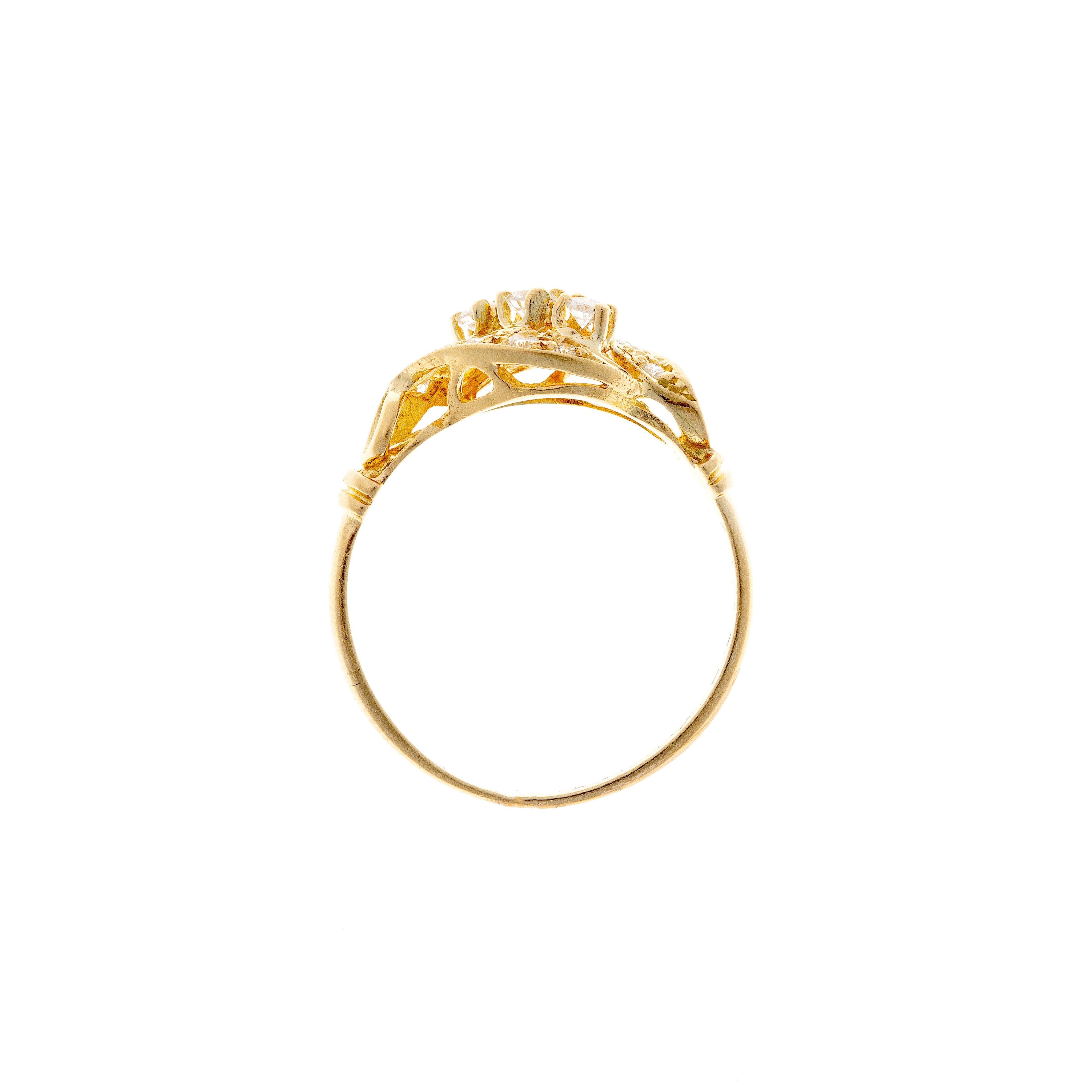 Profile view of a Mid-Century crossover diamond ring in 18K gold, displaying intricate gallery detailing and a refined band.