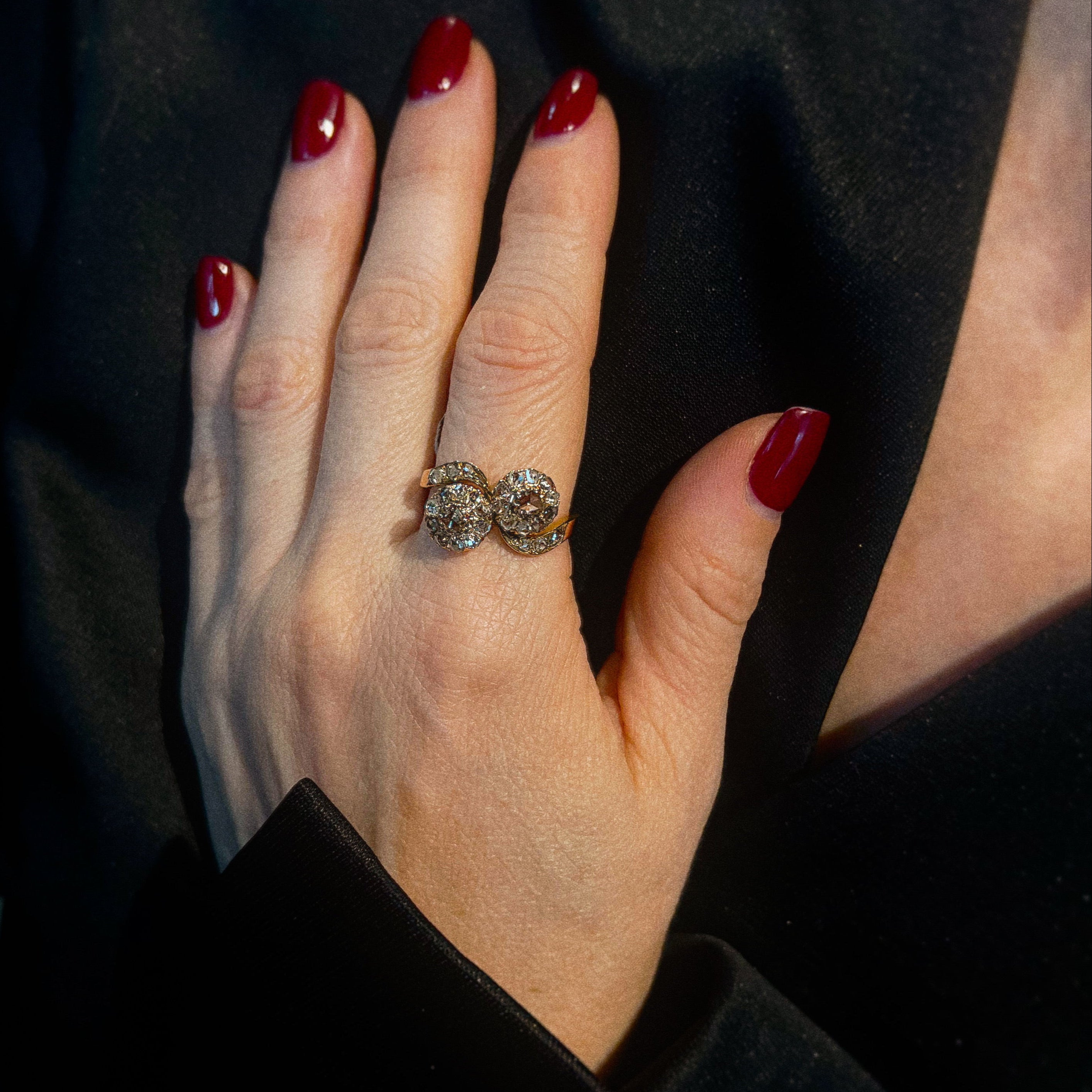 Model wearing the vintage rose gold engagement ring with diamonds.