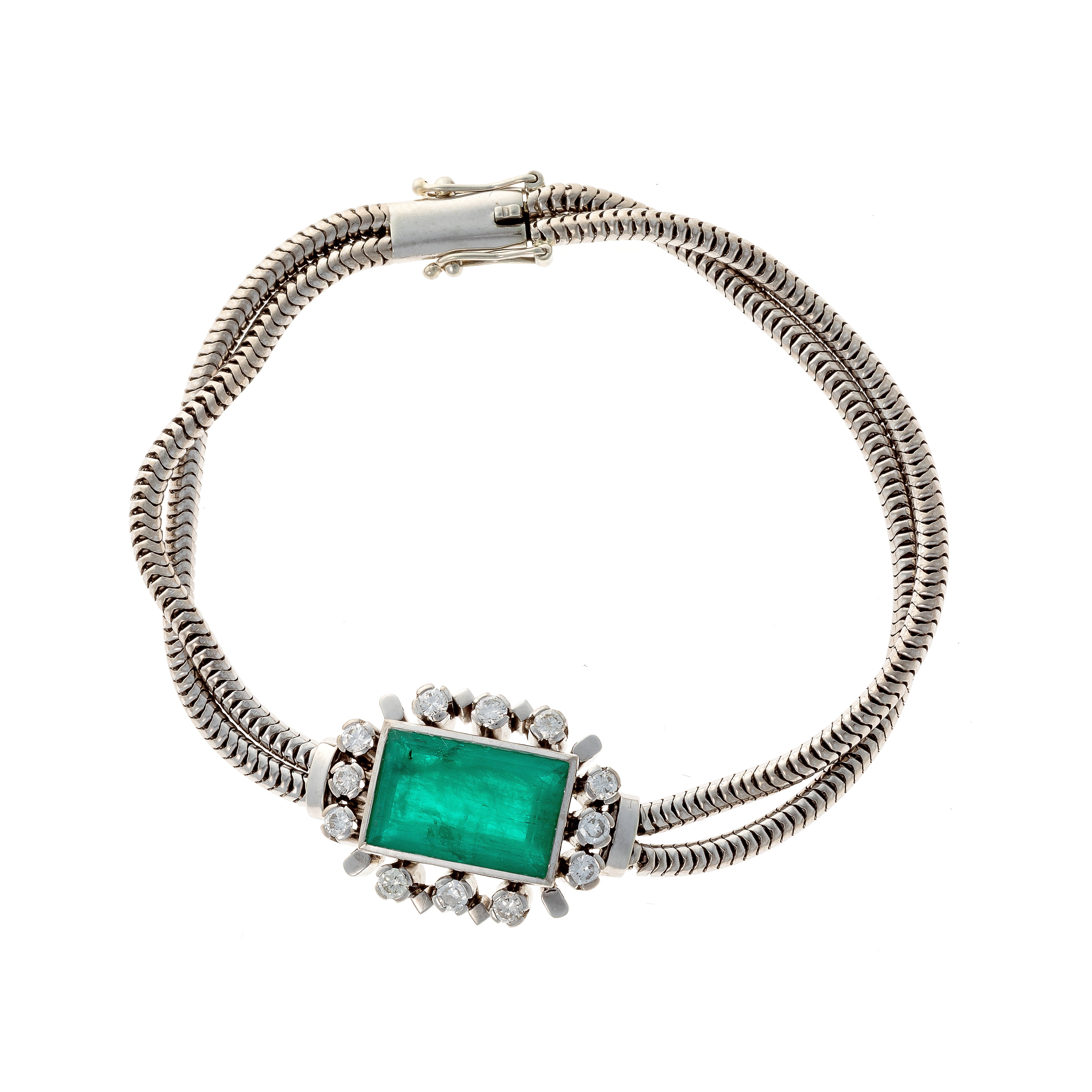 Vintage mid-century French white gold bracelet with lab-grown emerald centerpiece and diamonds.