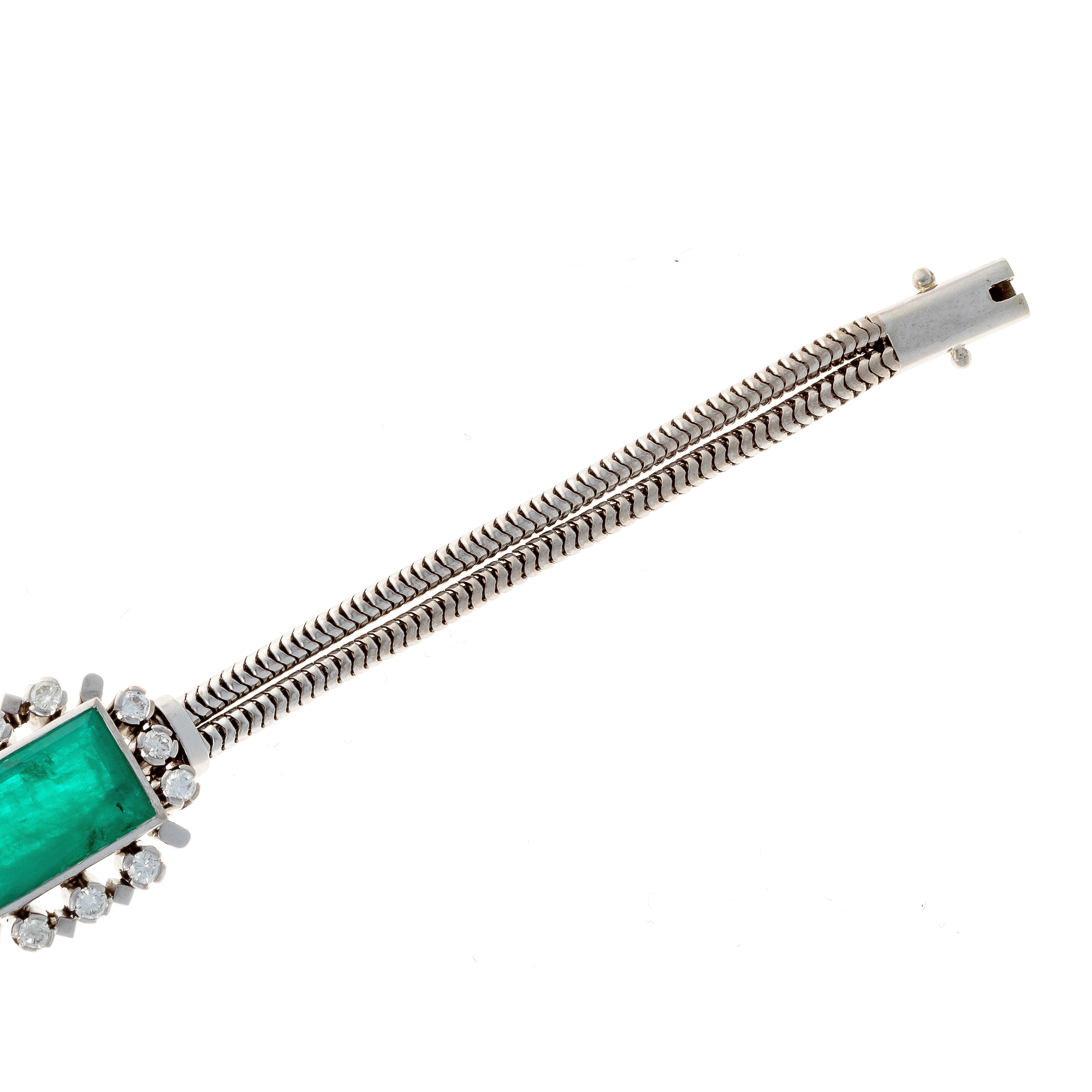 Closeup of the herringbone link design of the mid-century emerald and diamond bracelet.