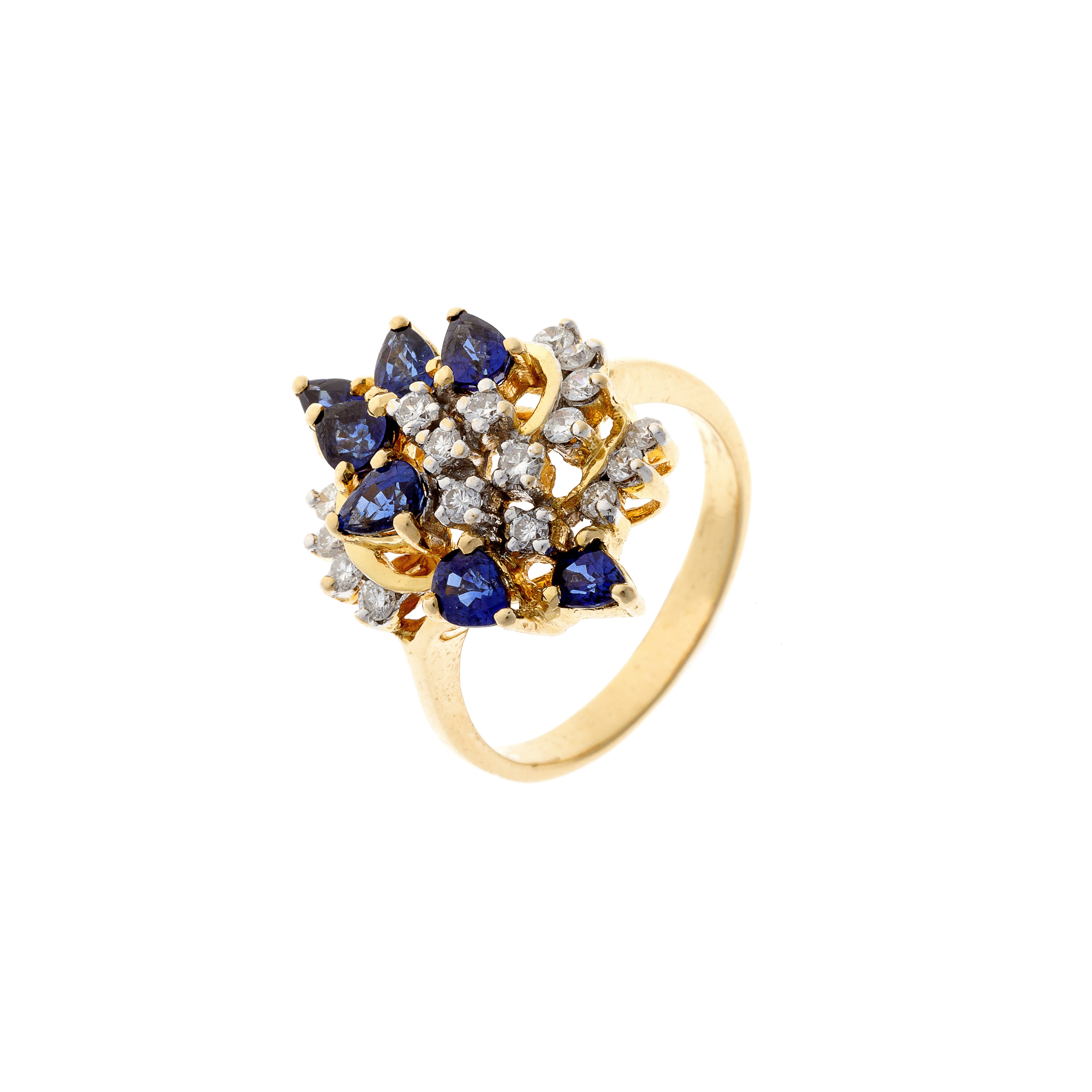 Angled view of a vintage French 18K gold ring showcasing the three-dimensional spray of sapphires and diamonds.
