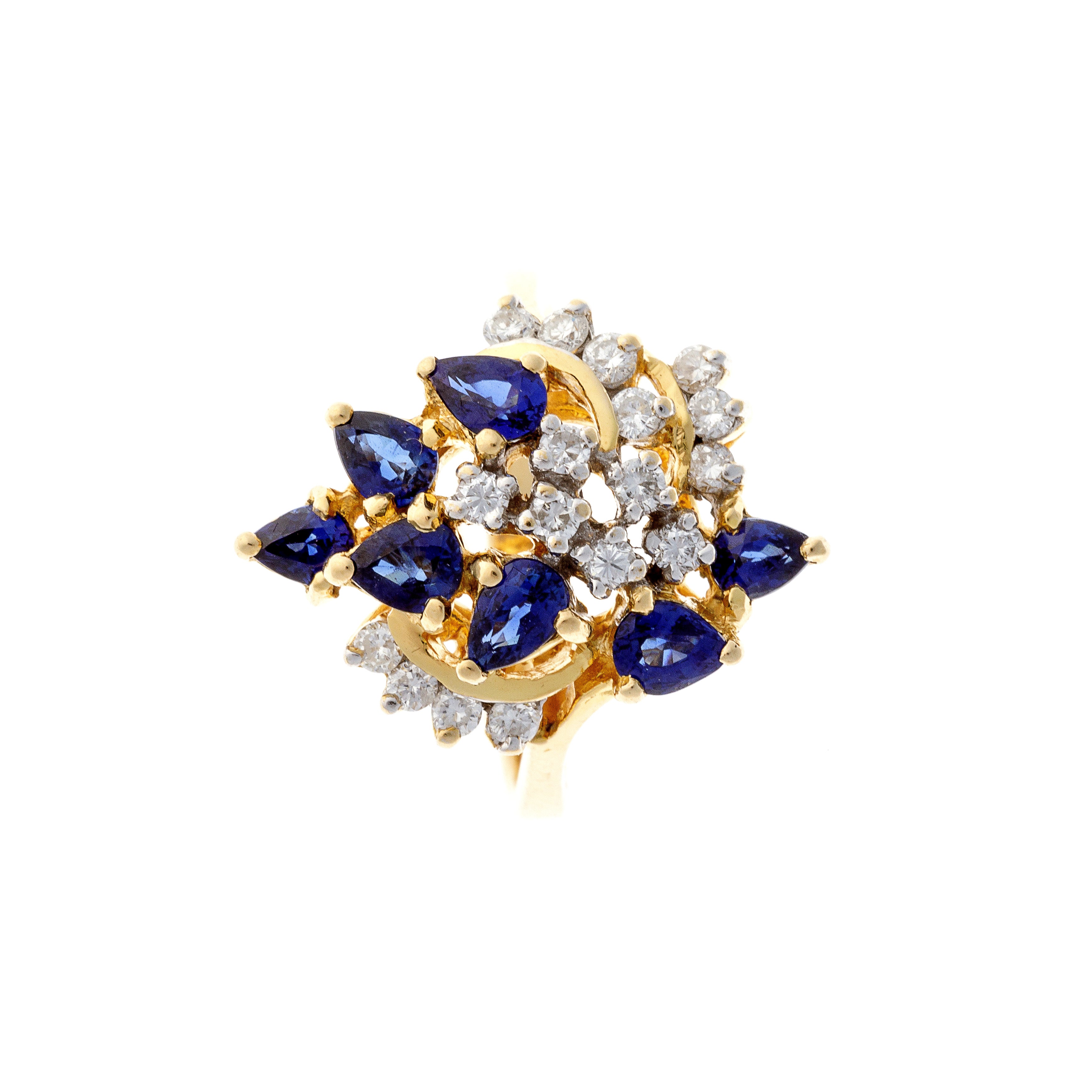 Top view of a Mid-Century French cocktail ring with seven pear-shaped sapphires and brilliant-cut diamonds set in 18K gold.