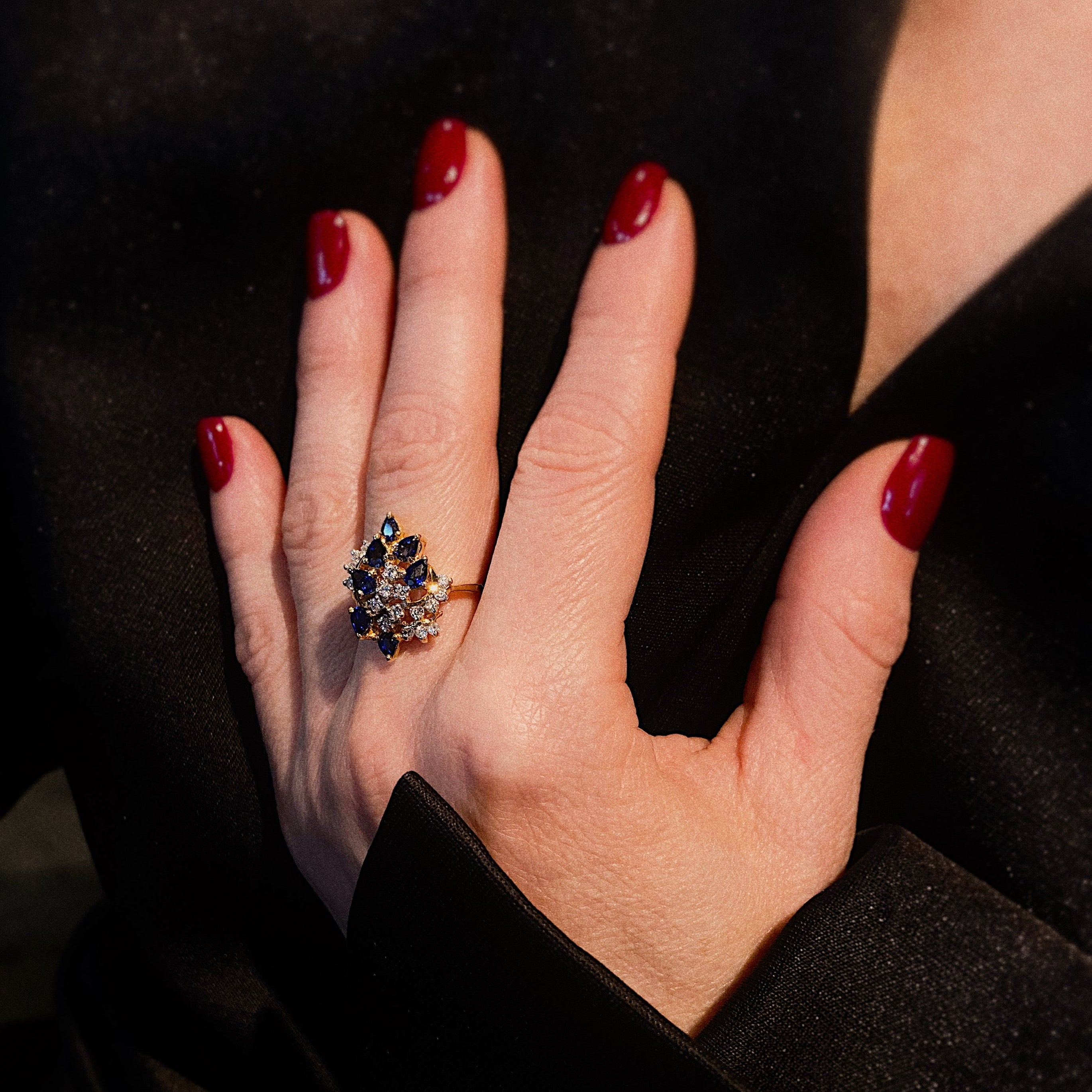 Model wearing the mid-century gold sapphire and diamond cocktail ring.