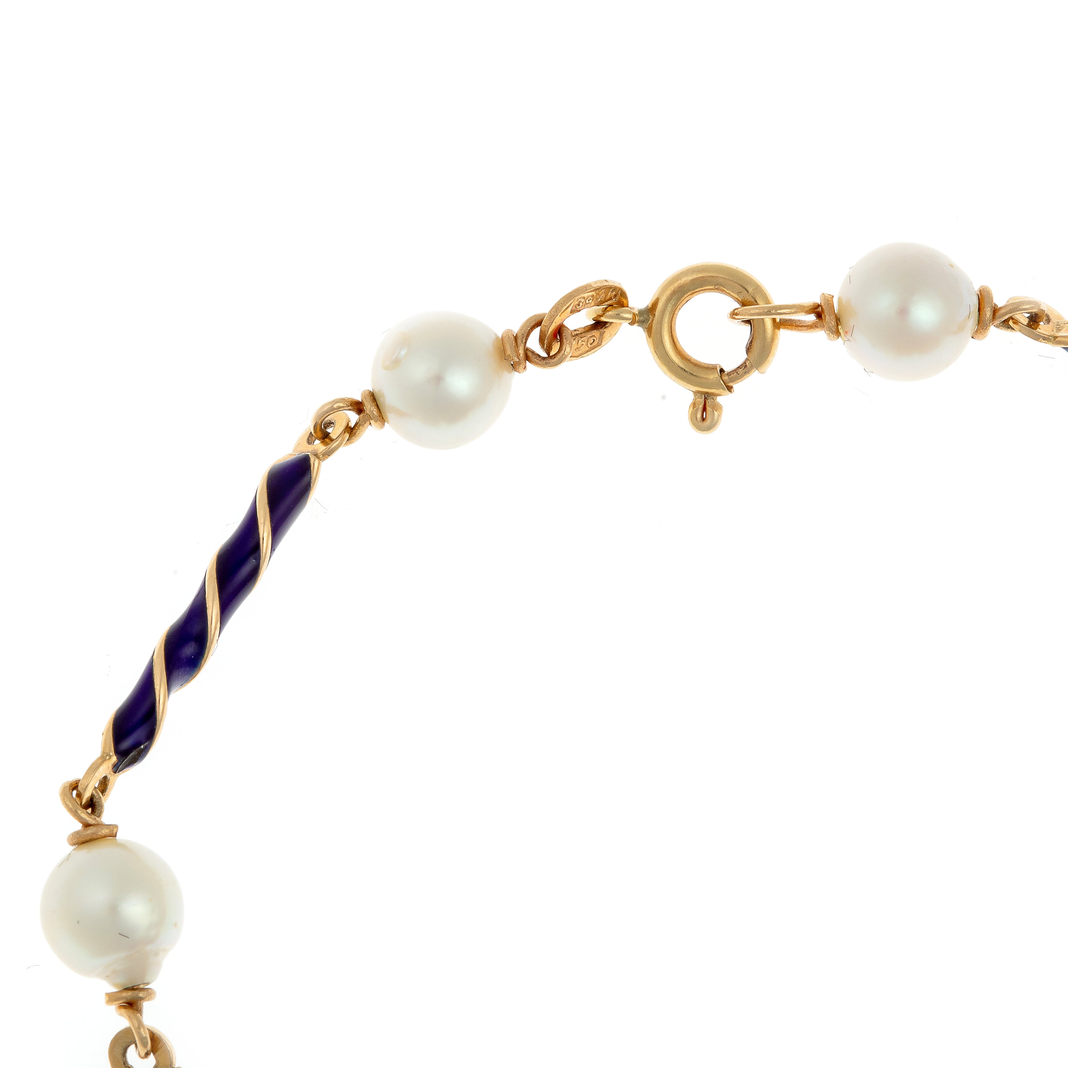 Close-up of clasp and pearl detailing on Mid-Century gold and enamel bracelet.
