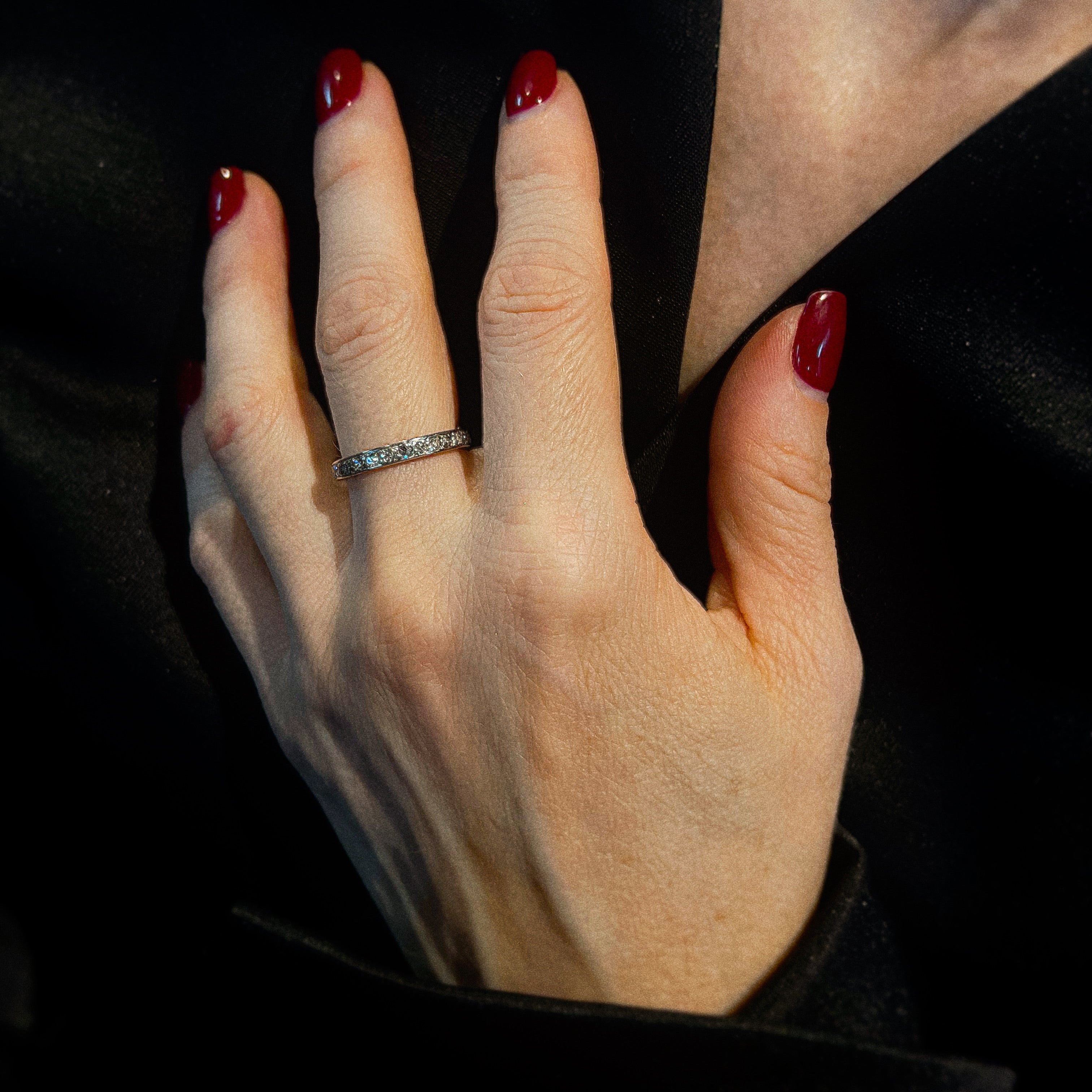 Model wearing the Mid-Century platinum diamond eternity ring on hand.