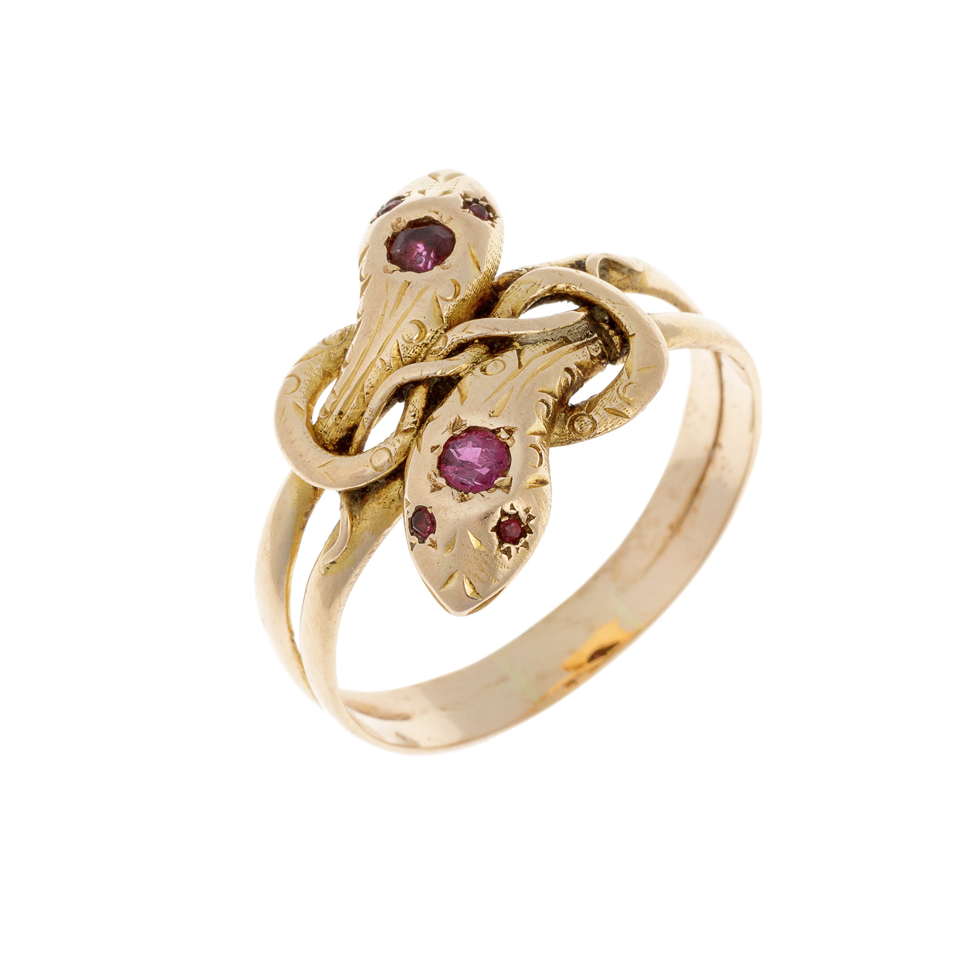 Angled shot of mid-century dual snake gold ring featuring rubies in their heads.
