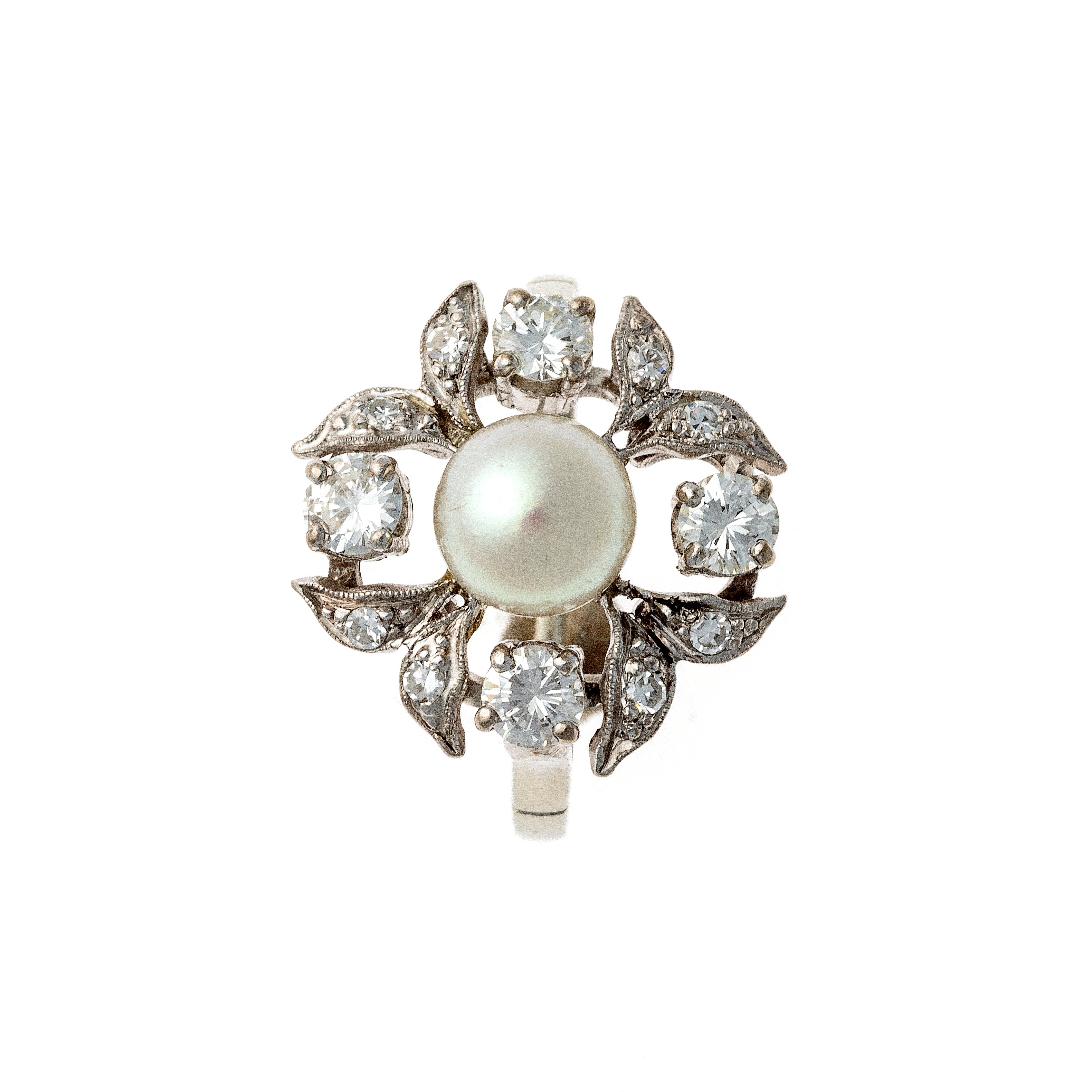 Top of the mid-century white gold floral ring with pearl center and diamond petals.