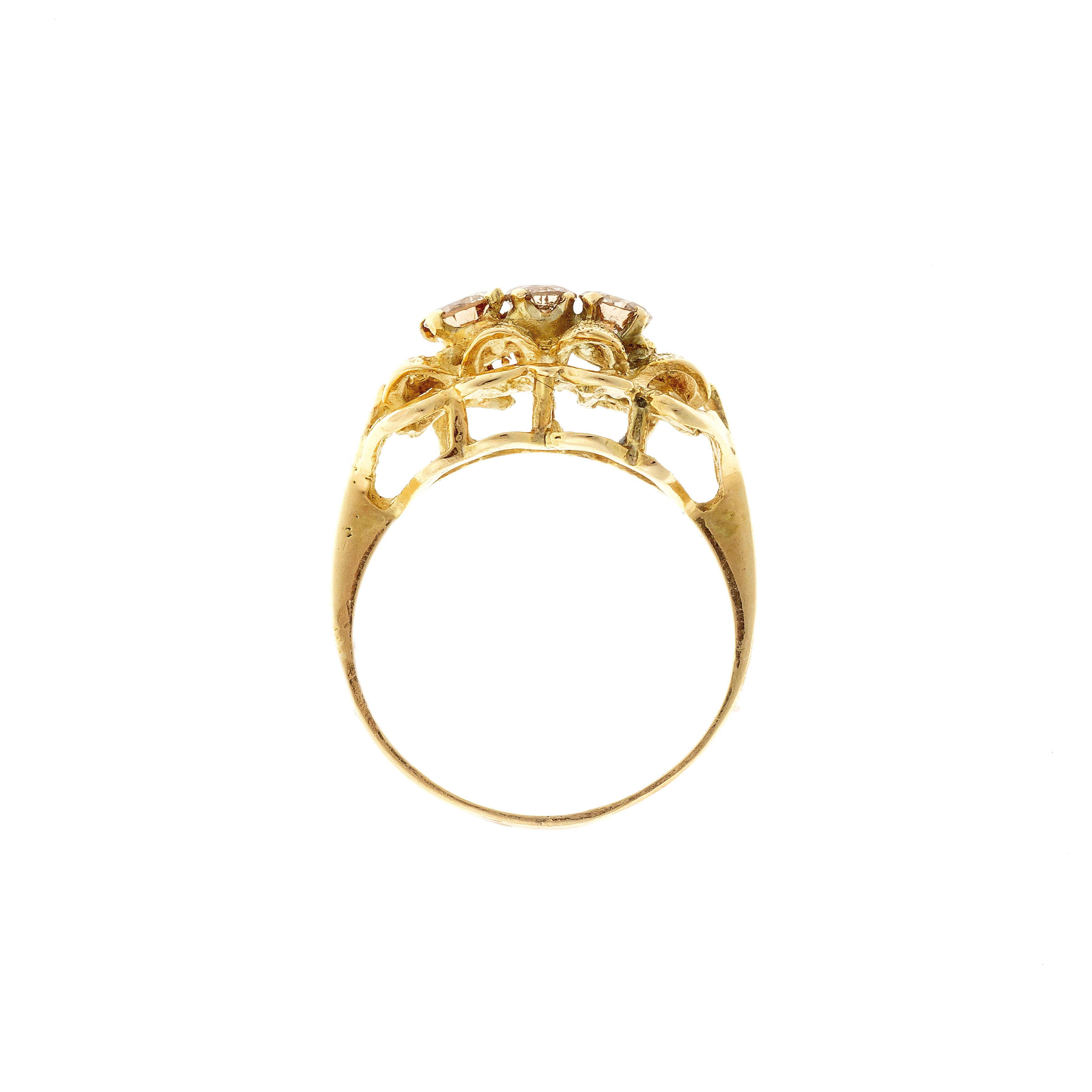 Profile of the Mid-Century modernist gold sculptural diamond trilogy ring.