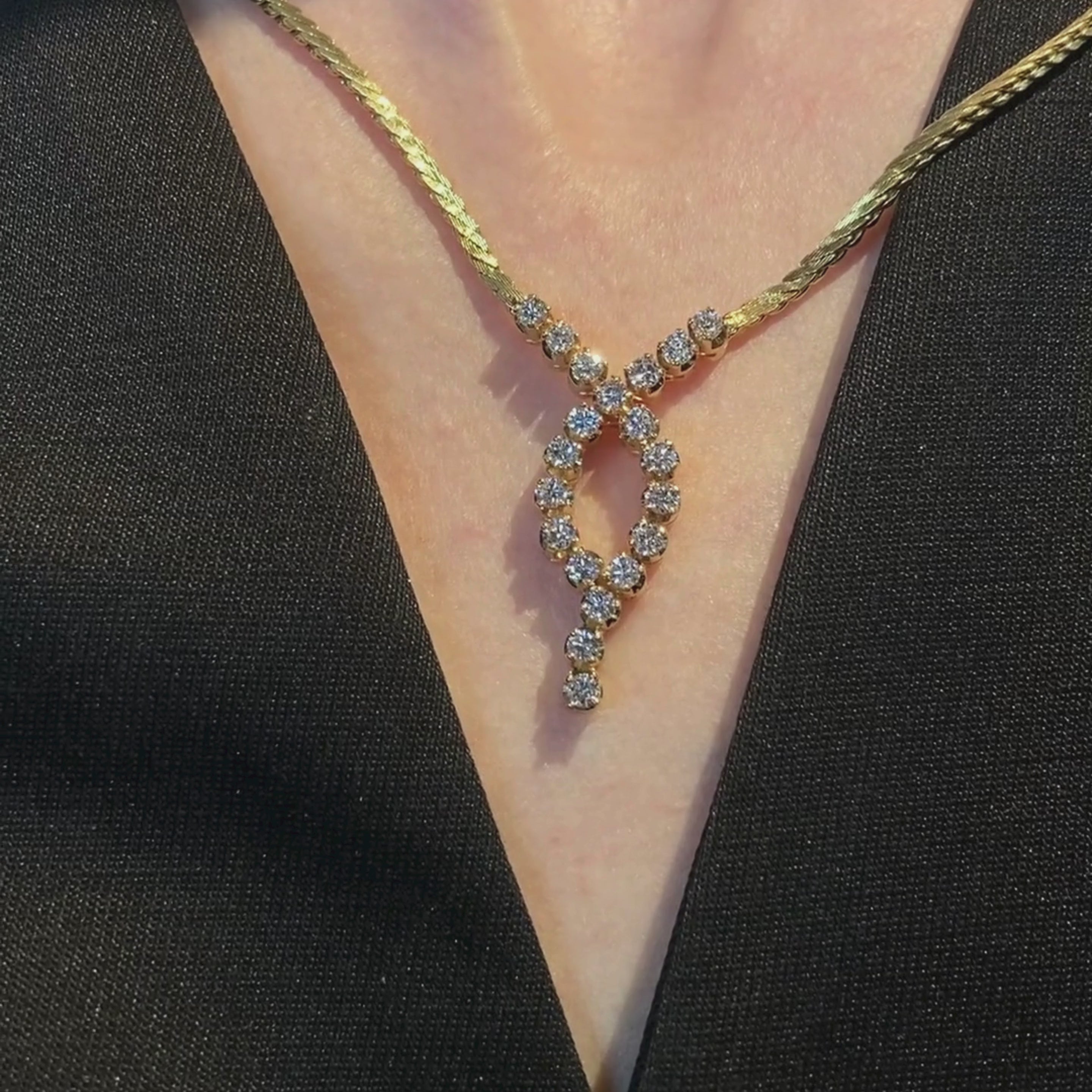 Woman wearing the elegant vintage Dutch 18K gold necklace with 20 brilliant-cut diamonds.