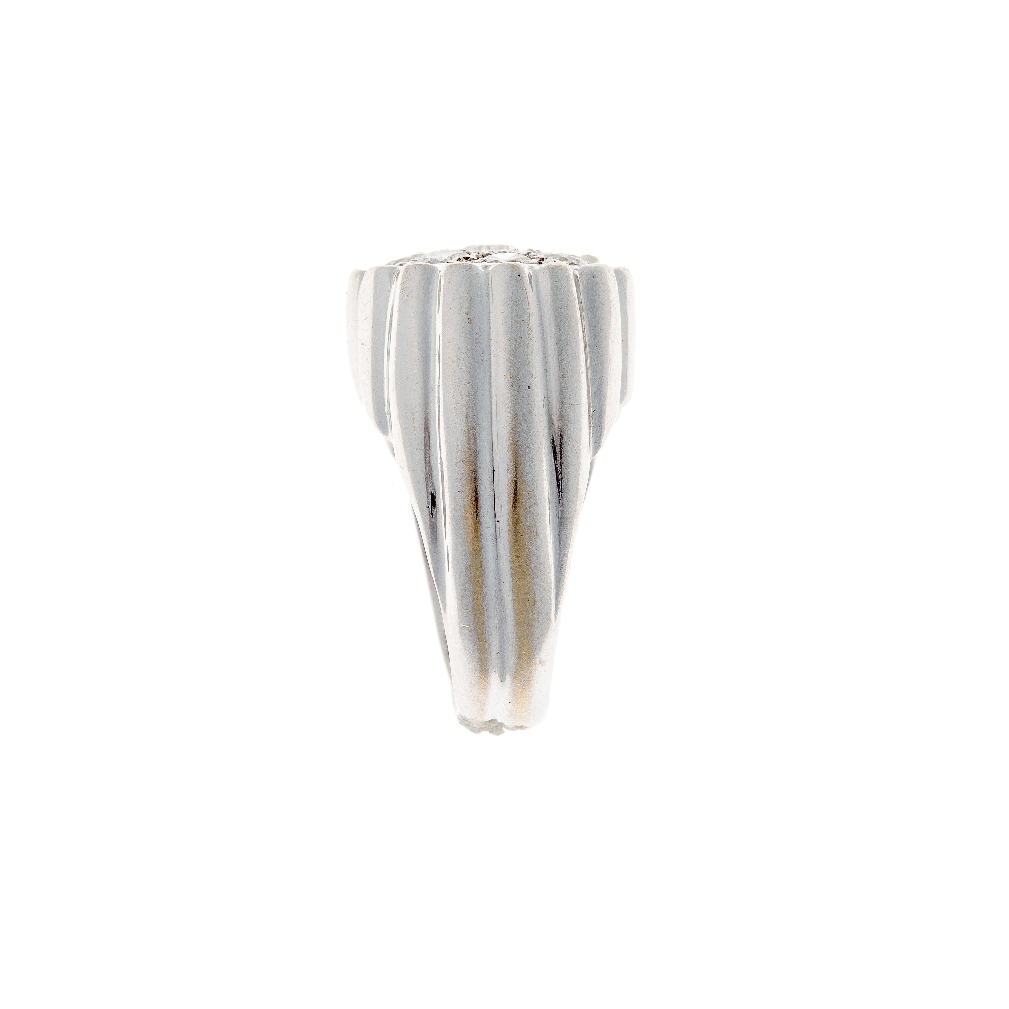 Side view of a sculptural Retro diamond ring in 18K white gold, highlighting the fluted texture and domed silhouette.