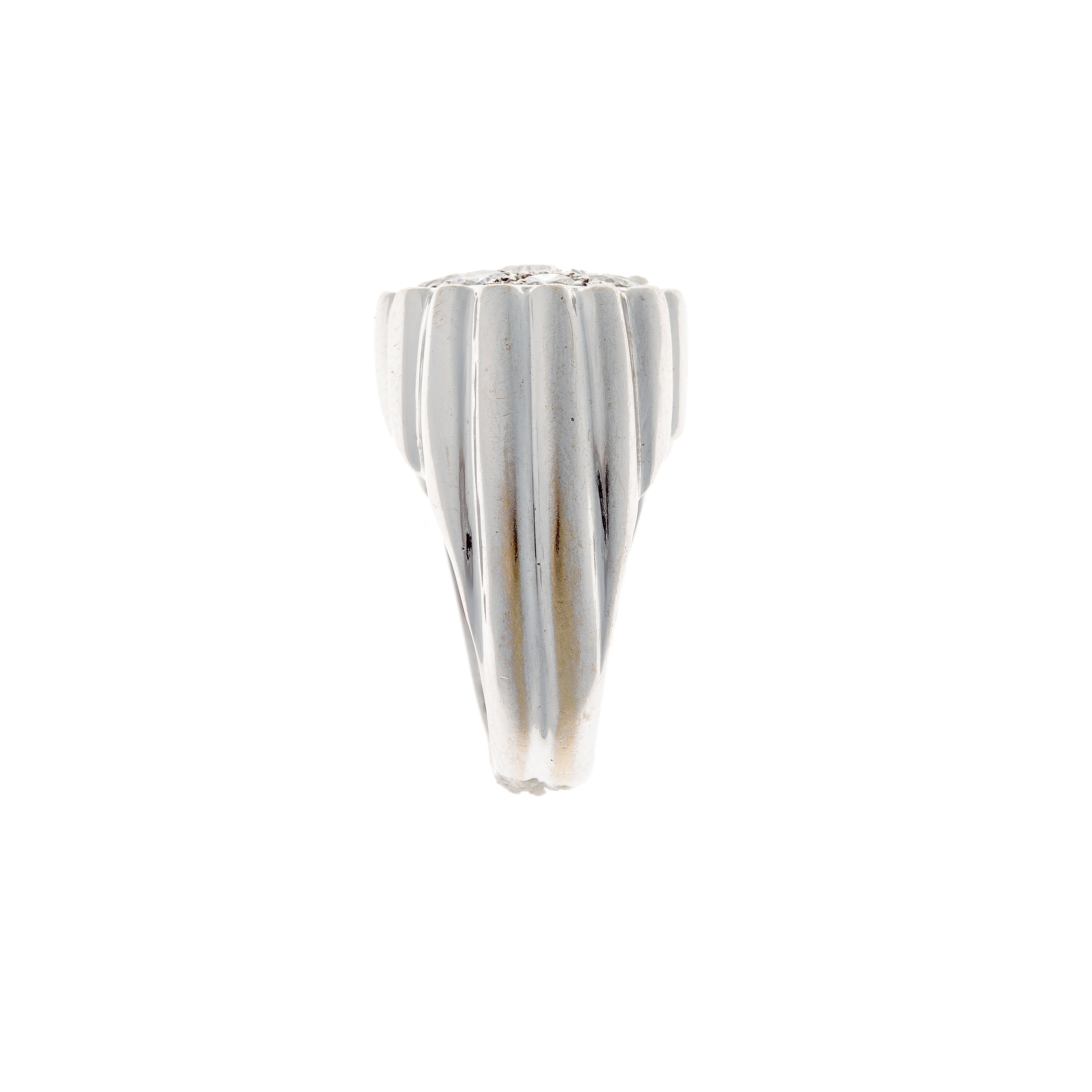 Side view of a sculptural Retro diamond ring in 18K white gold, highlighting the fluted texture and domed silhouette.