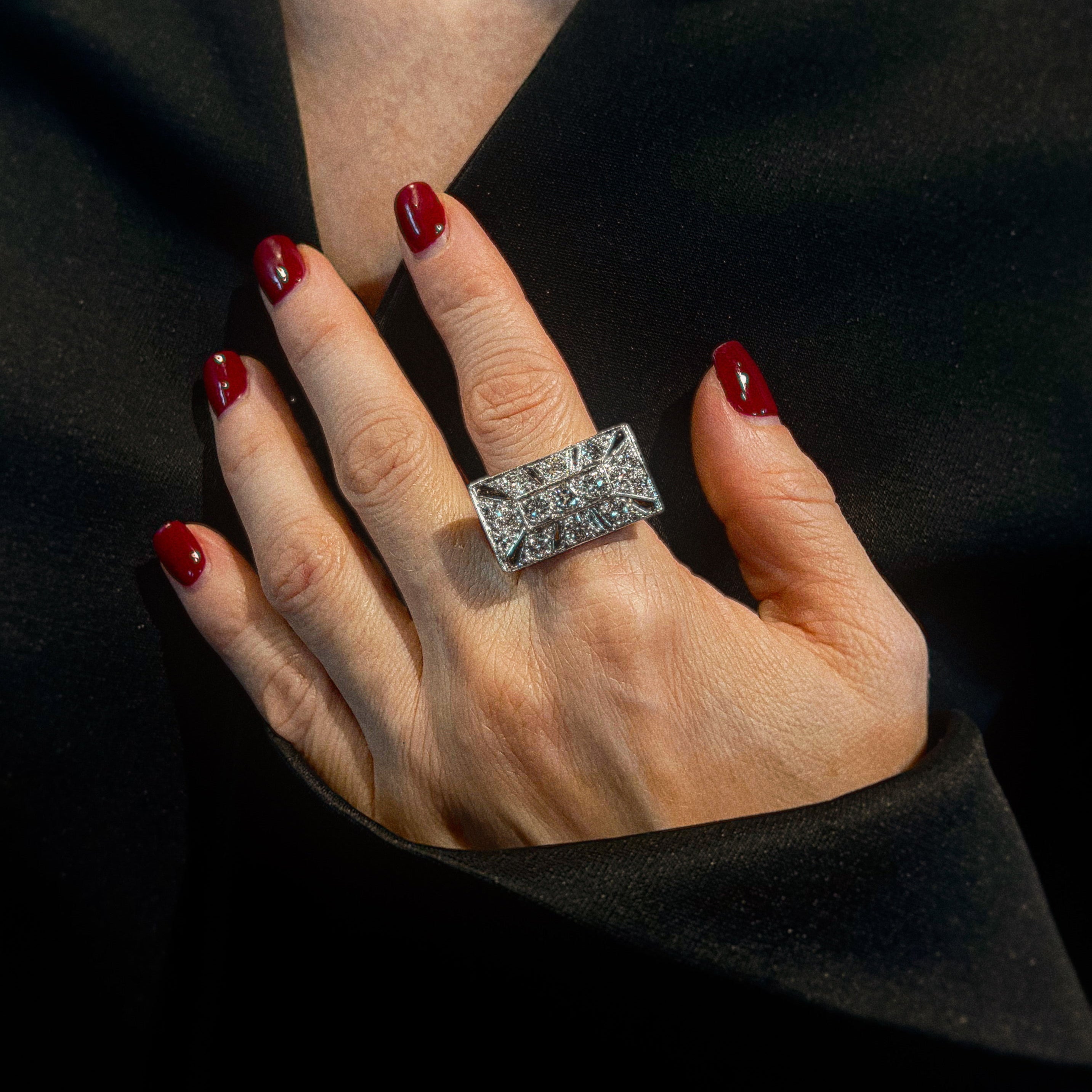 Model wearing the retro tank white gold cocktail statement ring with diamonds.