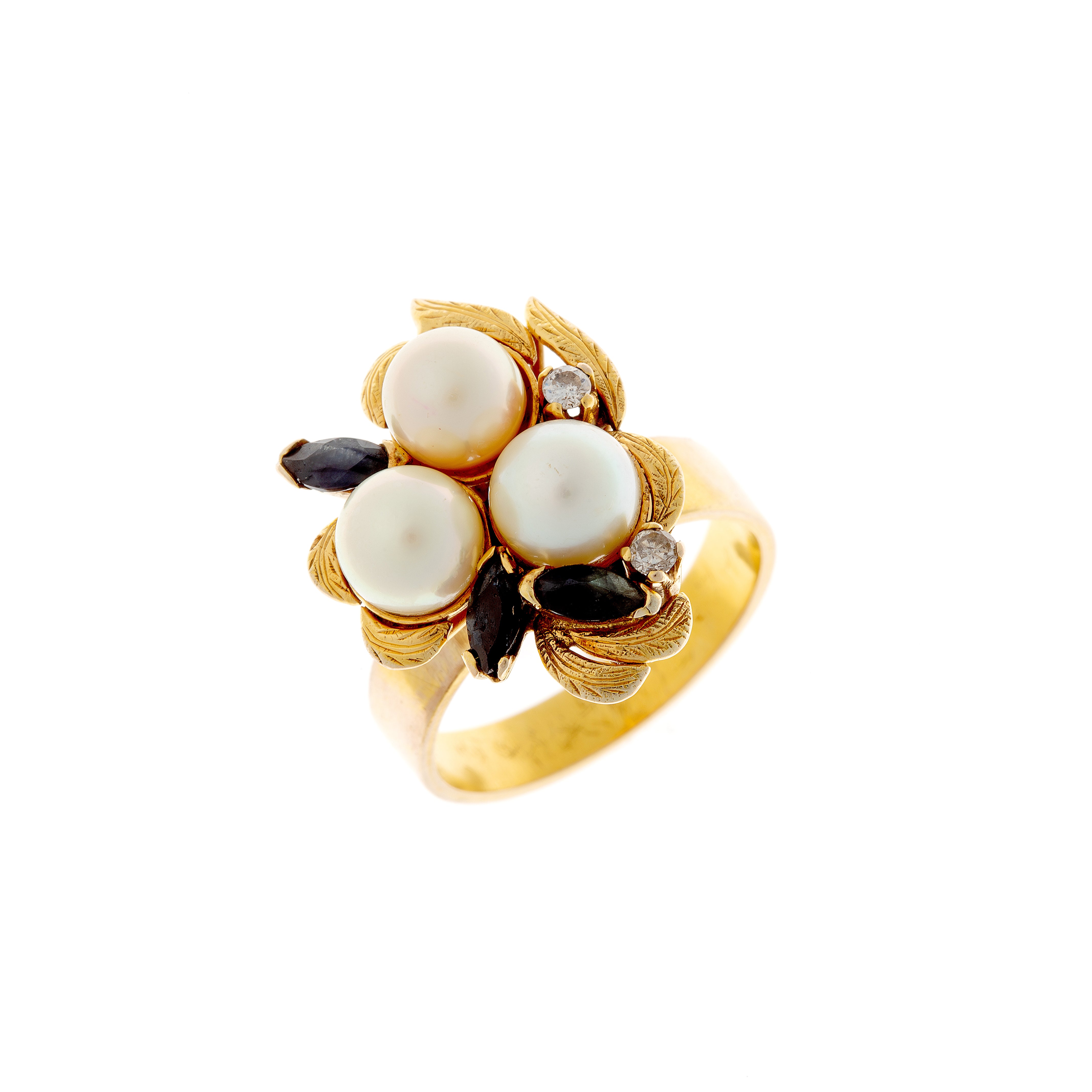 Angled view of Retro gold ring showcasing pearl cluster and sapphire accents.