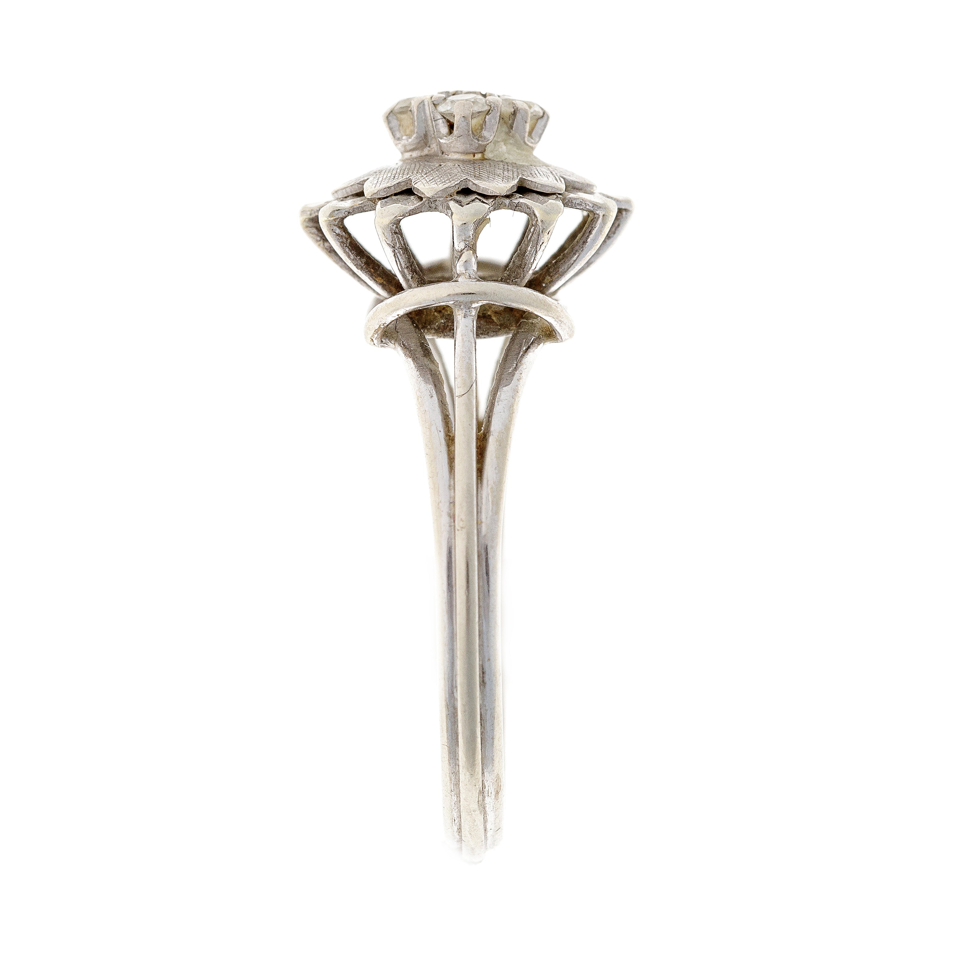 Side view of the retro cubic zirconia flower ring, highlighting its raised setting and intricate white gold details.