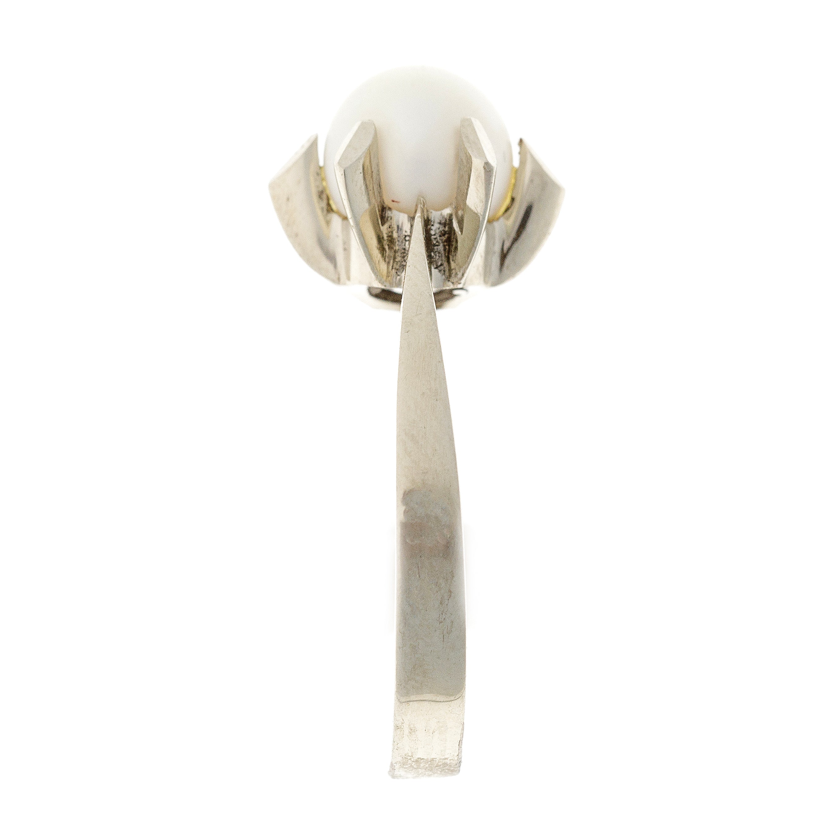 Side view of the retro cultured pearl ring, highlighting the raised setting and the smooth curvature of the white gold band.