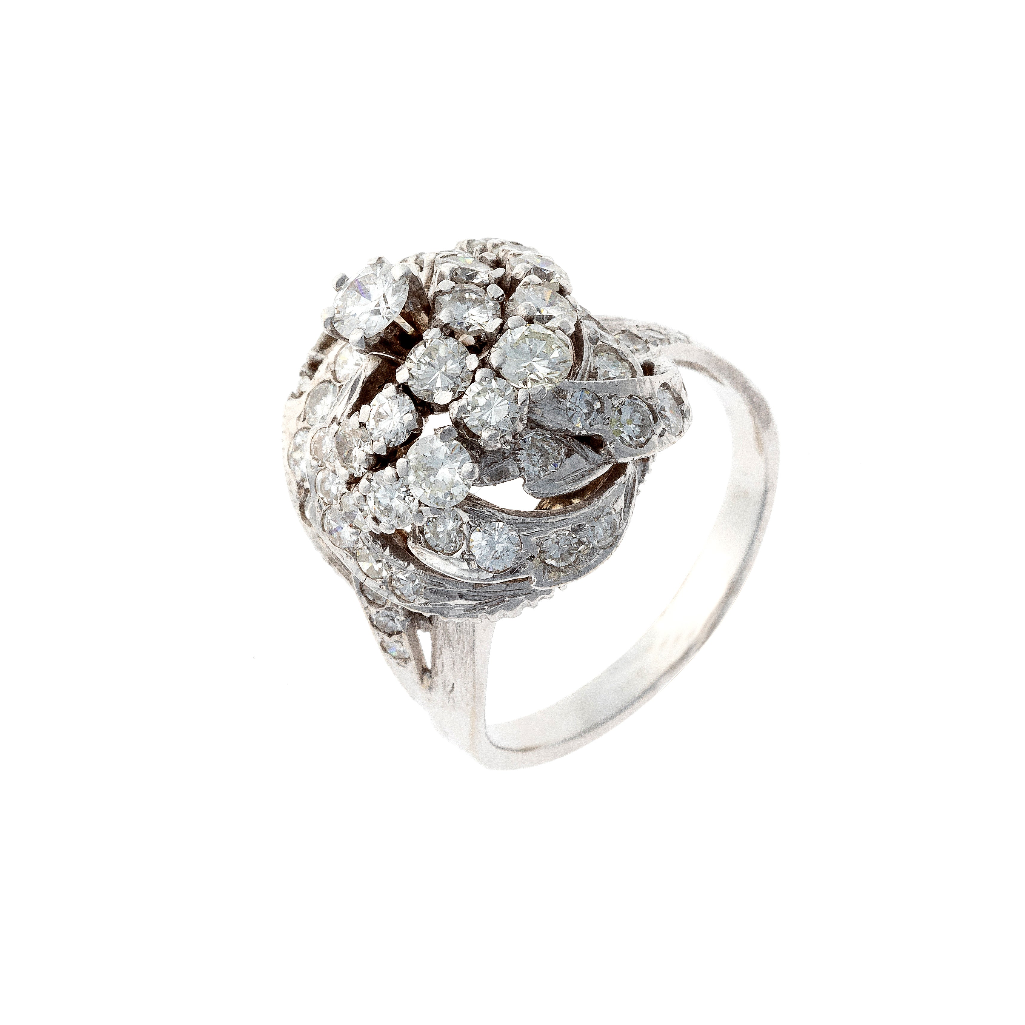 Retro white gold sculptural diamond knot cocktail ring.