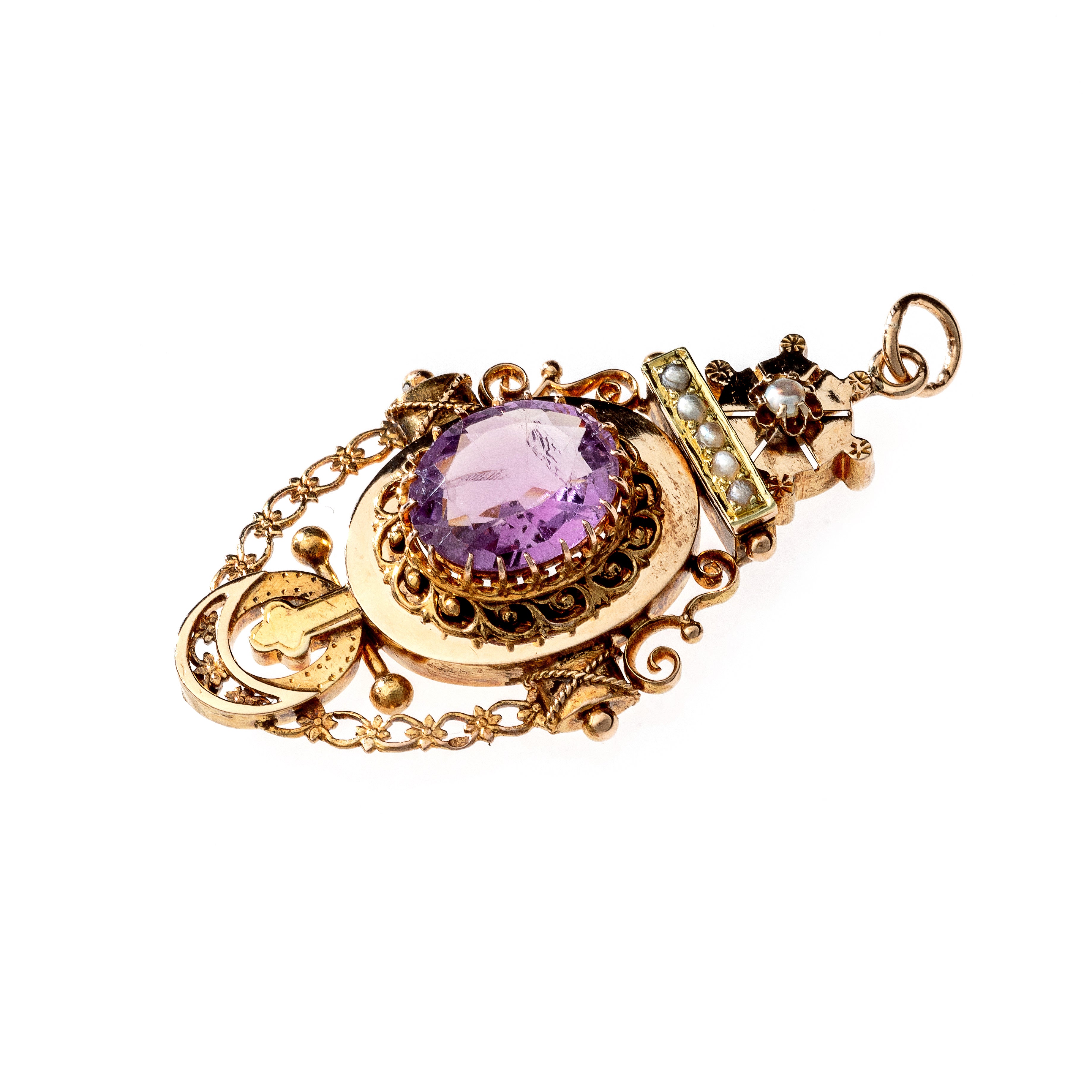 Angled view of the antique Victorian Etruscan Revival pendant, highlighting the intricate gold granulation and wirework.