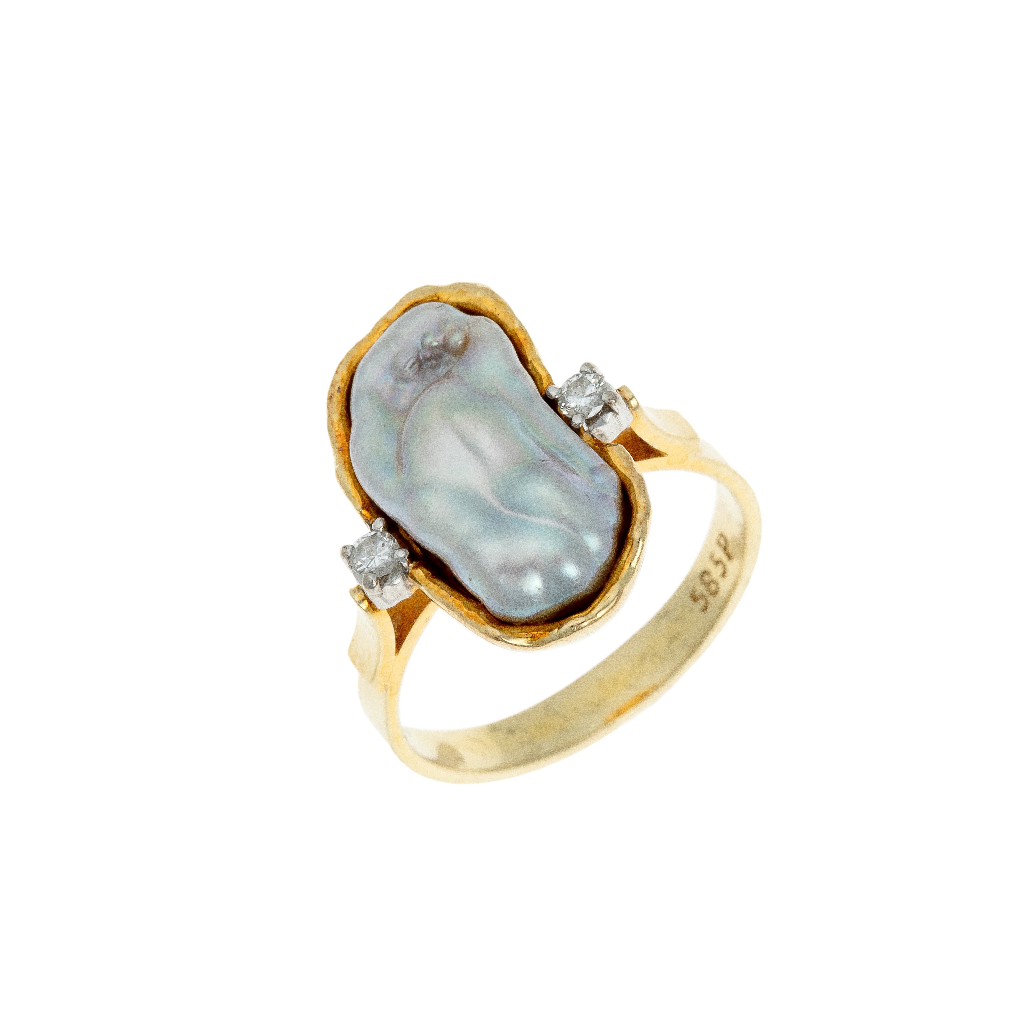 1980s French 14k gold ring featuring a large baroque pearl and two brilliant-cut diamonds, angled view.