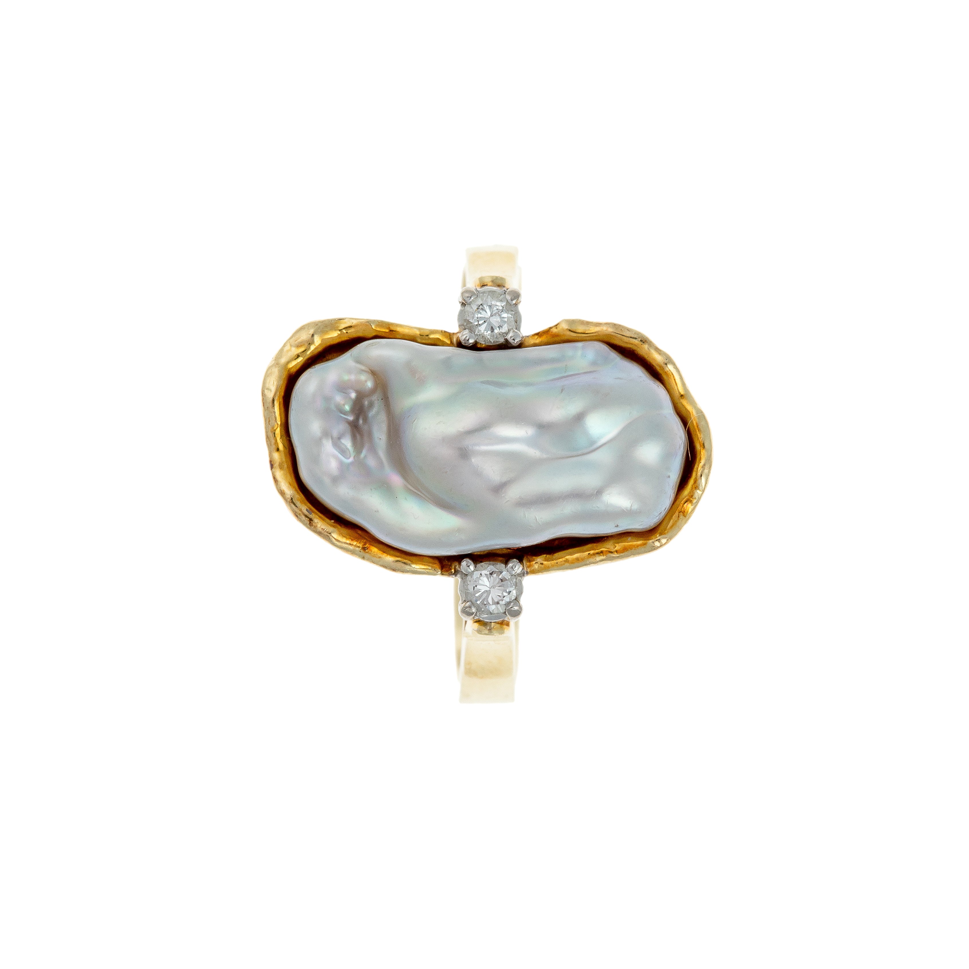 Top-down view of the organic baroque pearl centerpiece in a sculptural gold setting with diamonds.