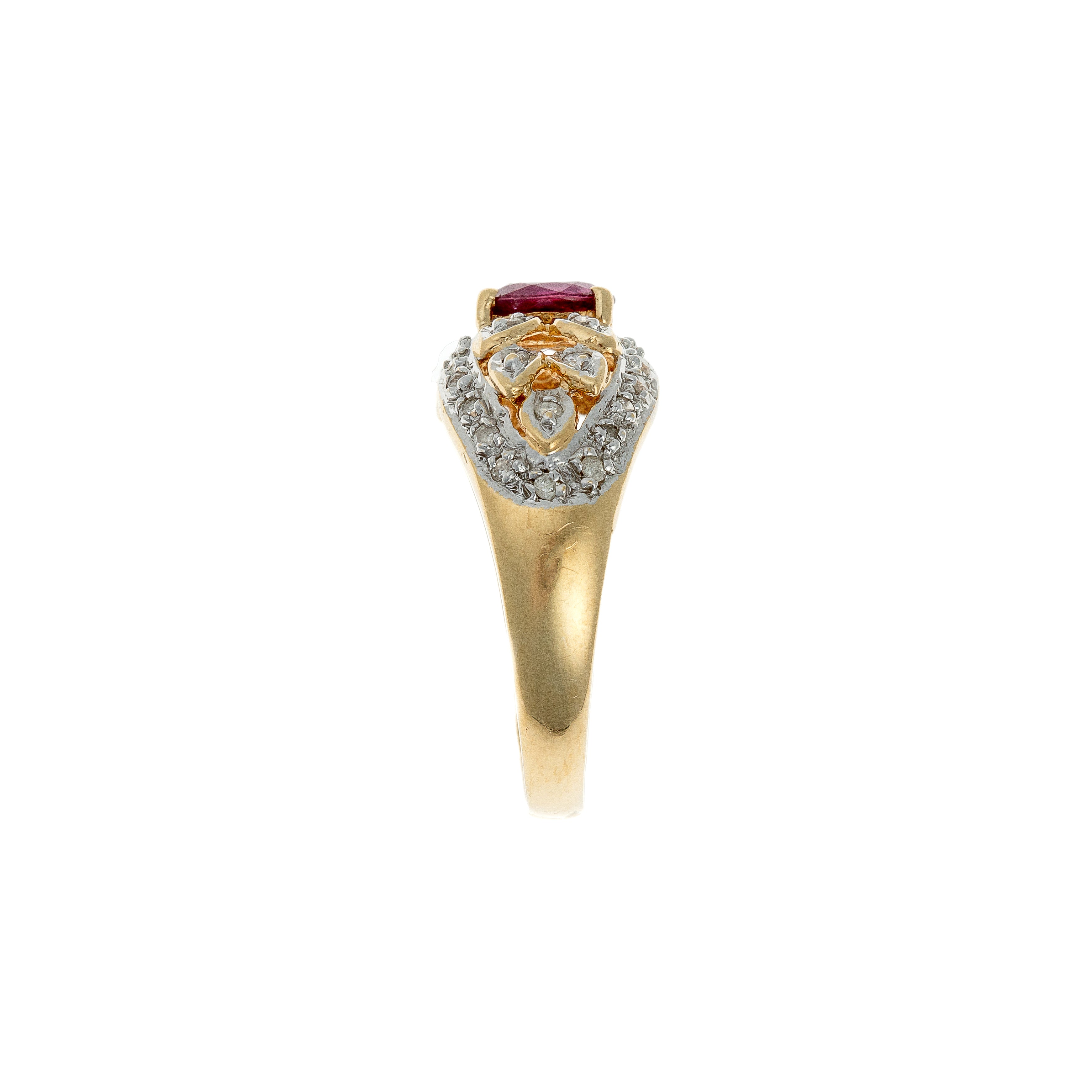 Side view highlighting gold band and elevated gemstone setting structure.