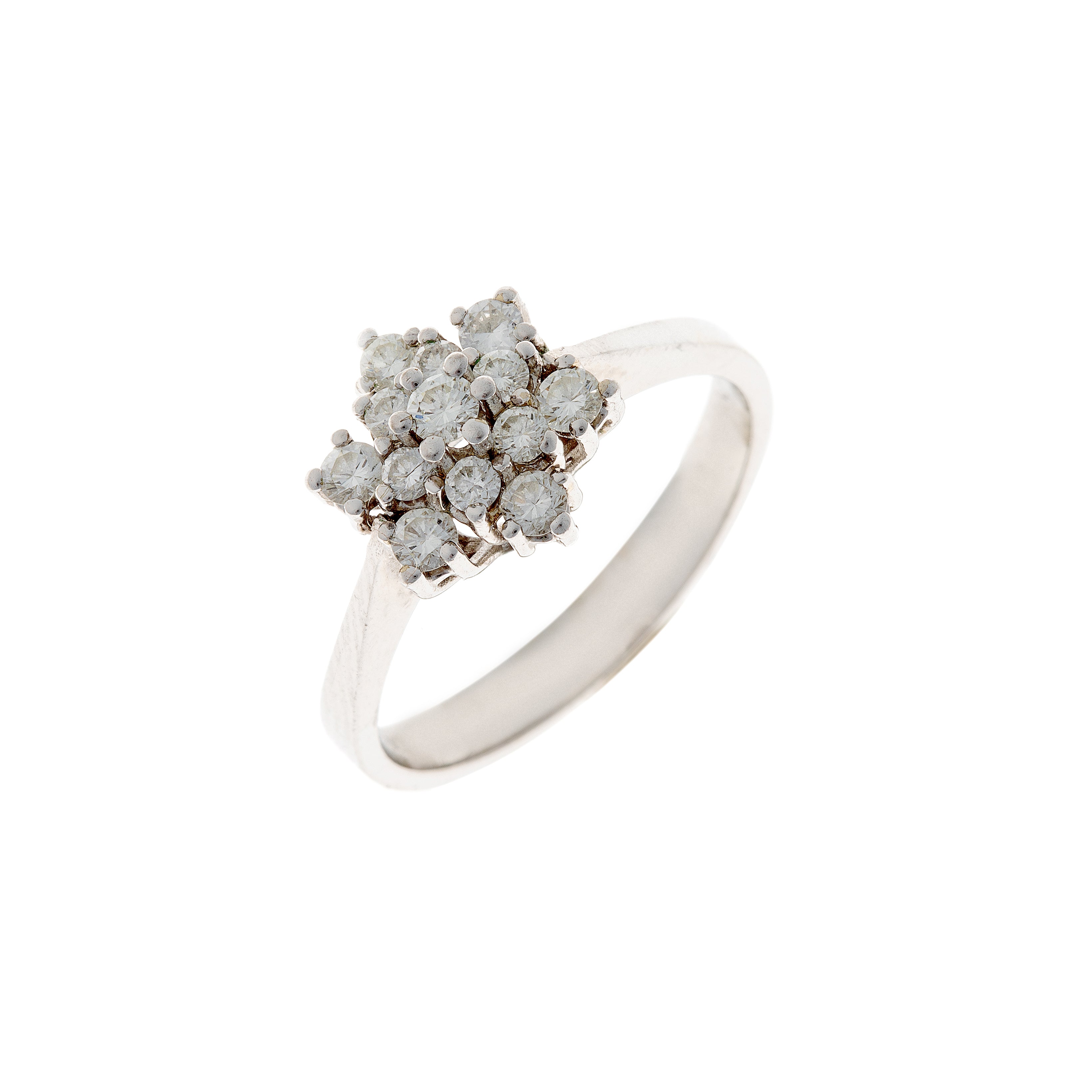 Vintage 14K white gold diamond cluster ring featuring 13 brilliant-cut diamonds in a floral-inspired setting, photographed at an angle.