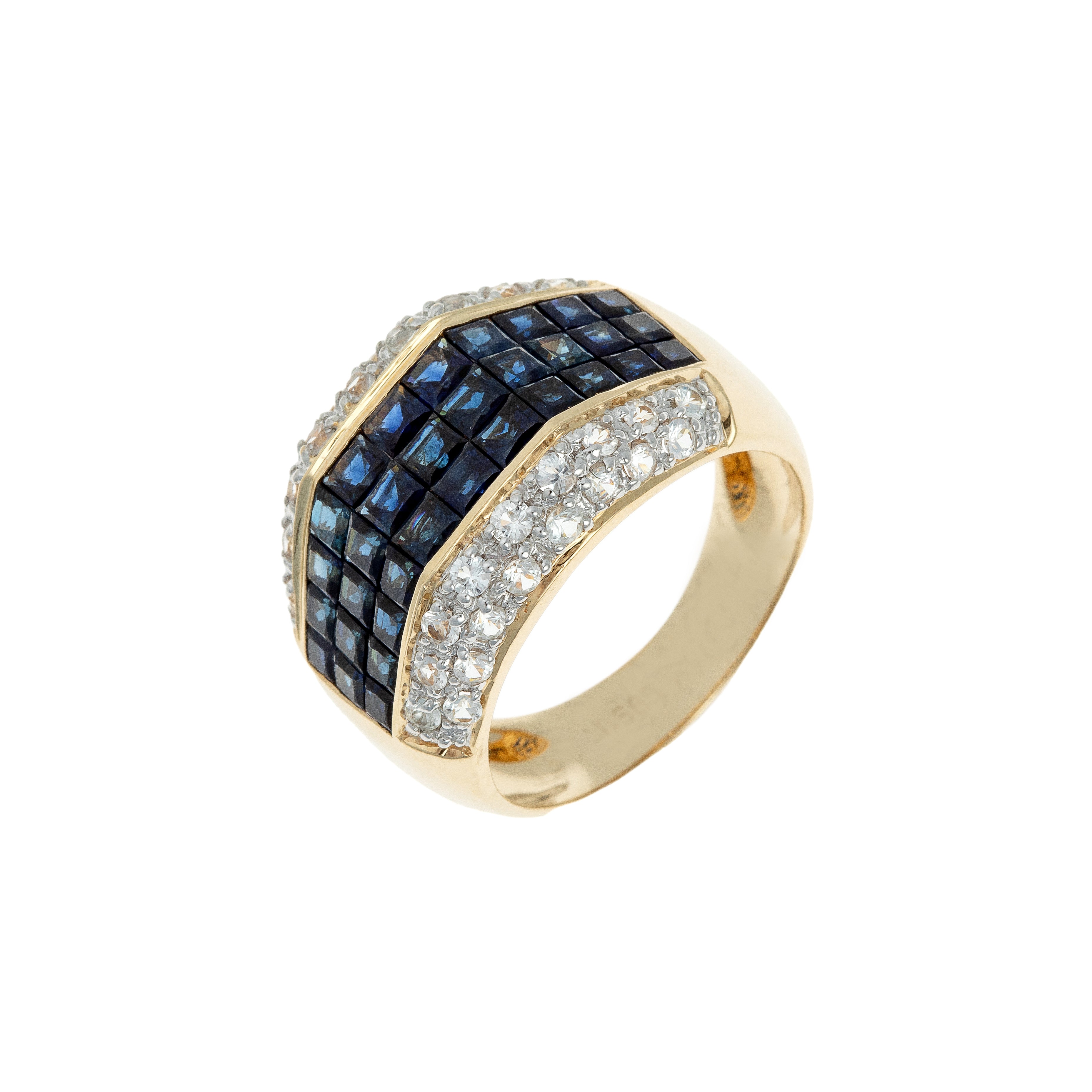 Angled view of the 1980s French gold cocktail ring with blue and clear sapphires.