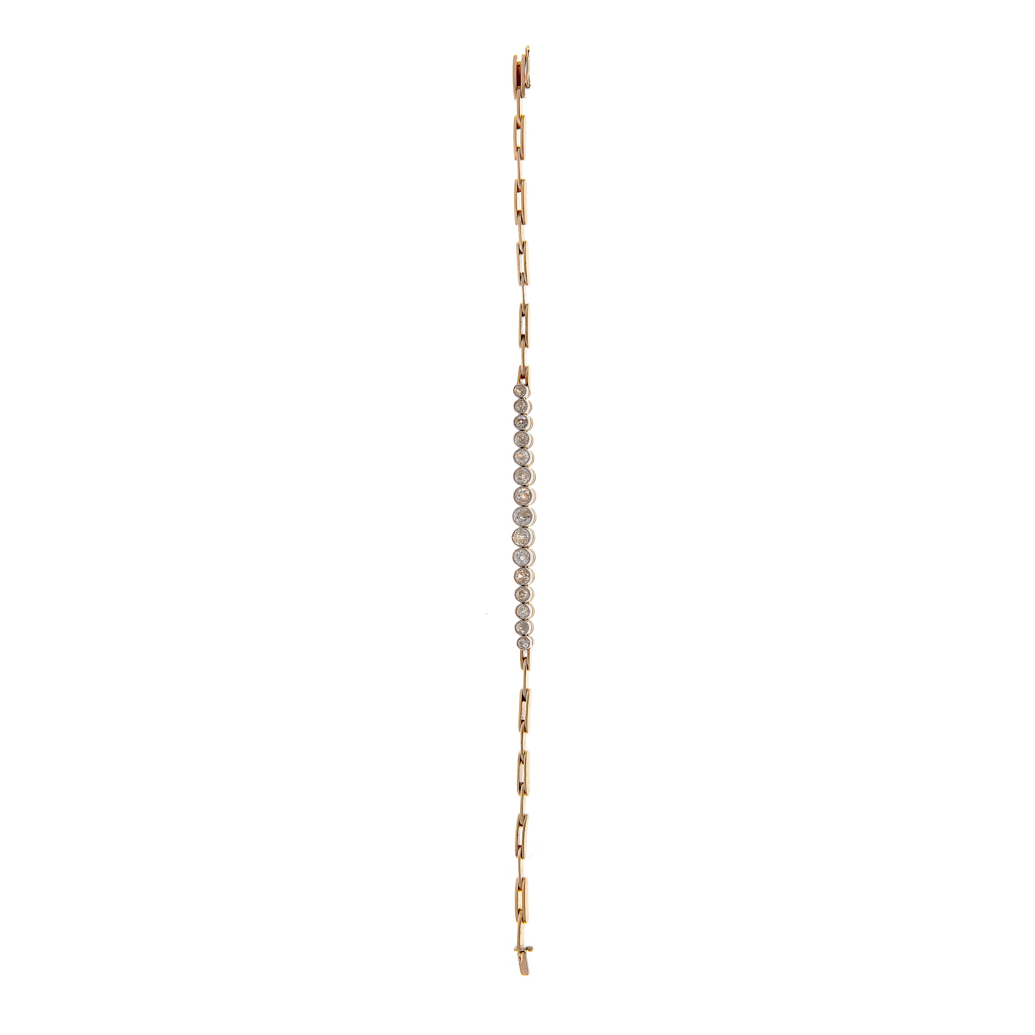 Full view of a vintage 9K gold and platinum diamond bracelet featuring a graduated old-cut diamond centerpiece.