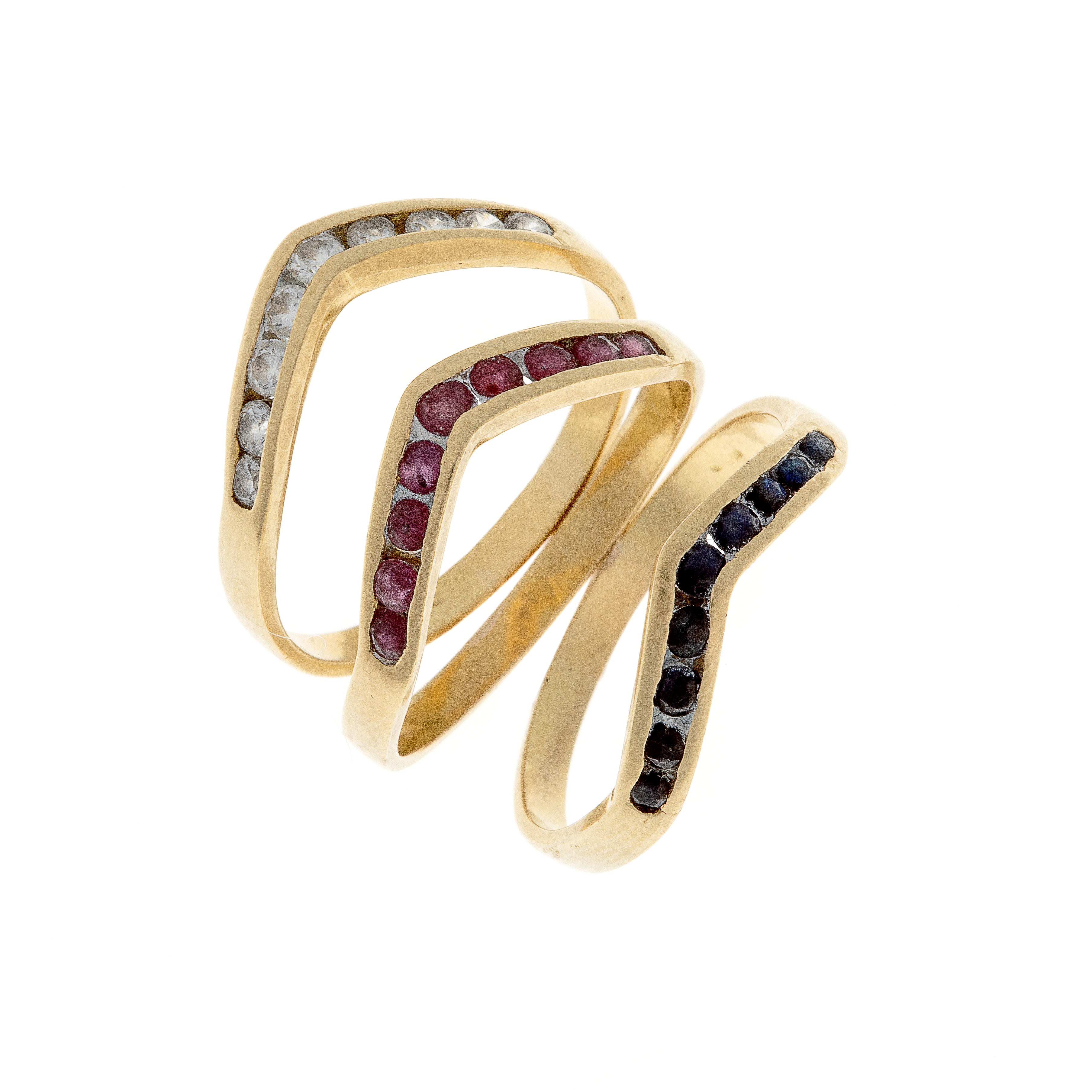 Angled view of modernist stacking rings showcasing architectural lines and colored gemstone inlay.