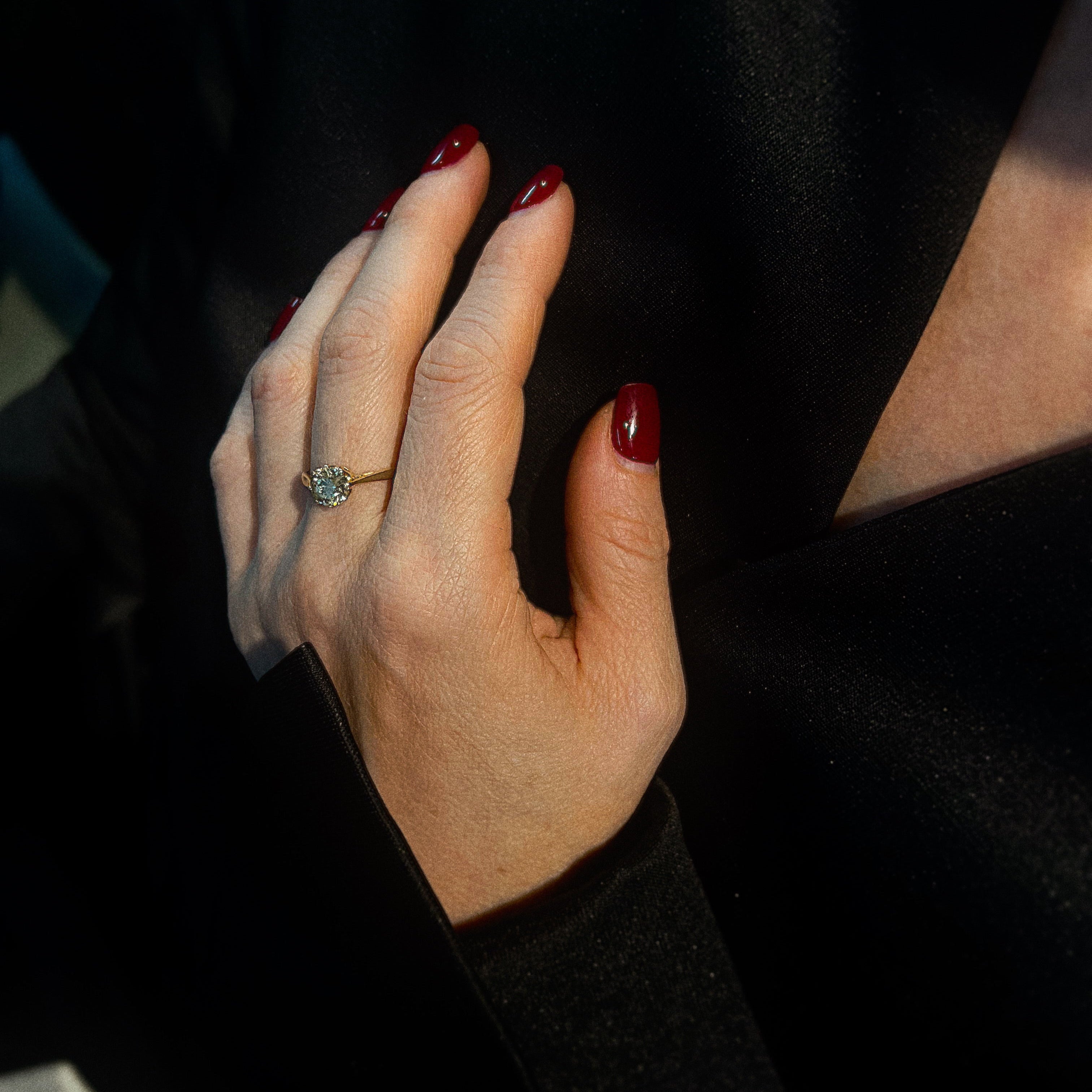 Model wearing the vintage gold diamond solitaire engagement ring.