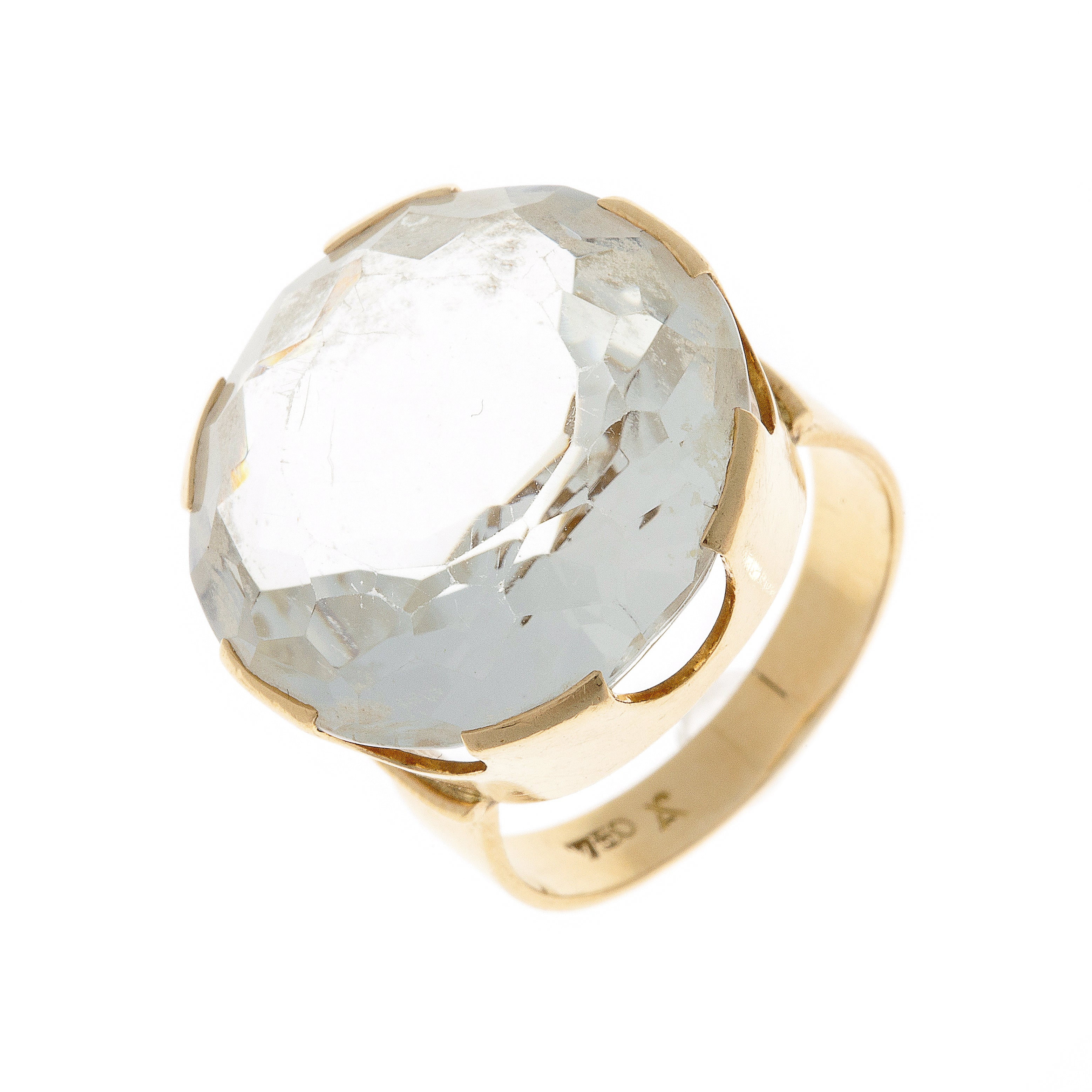 Angled view of vintage Fries Arauner gold ring with rock crystal.