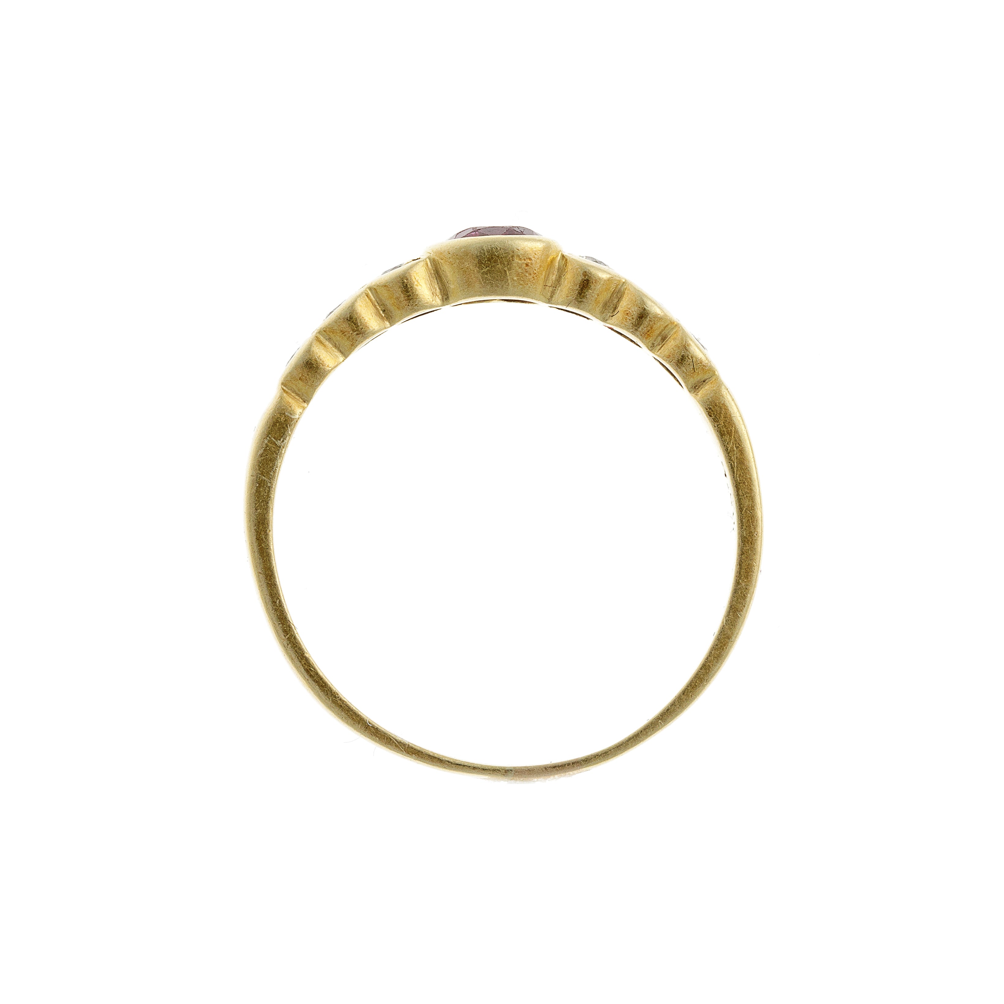 Profile view of the vintage ruby ring, emphasizing its bezel setting and smooth gold craftsmanship.