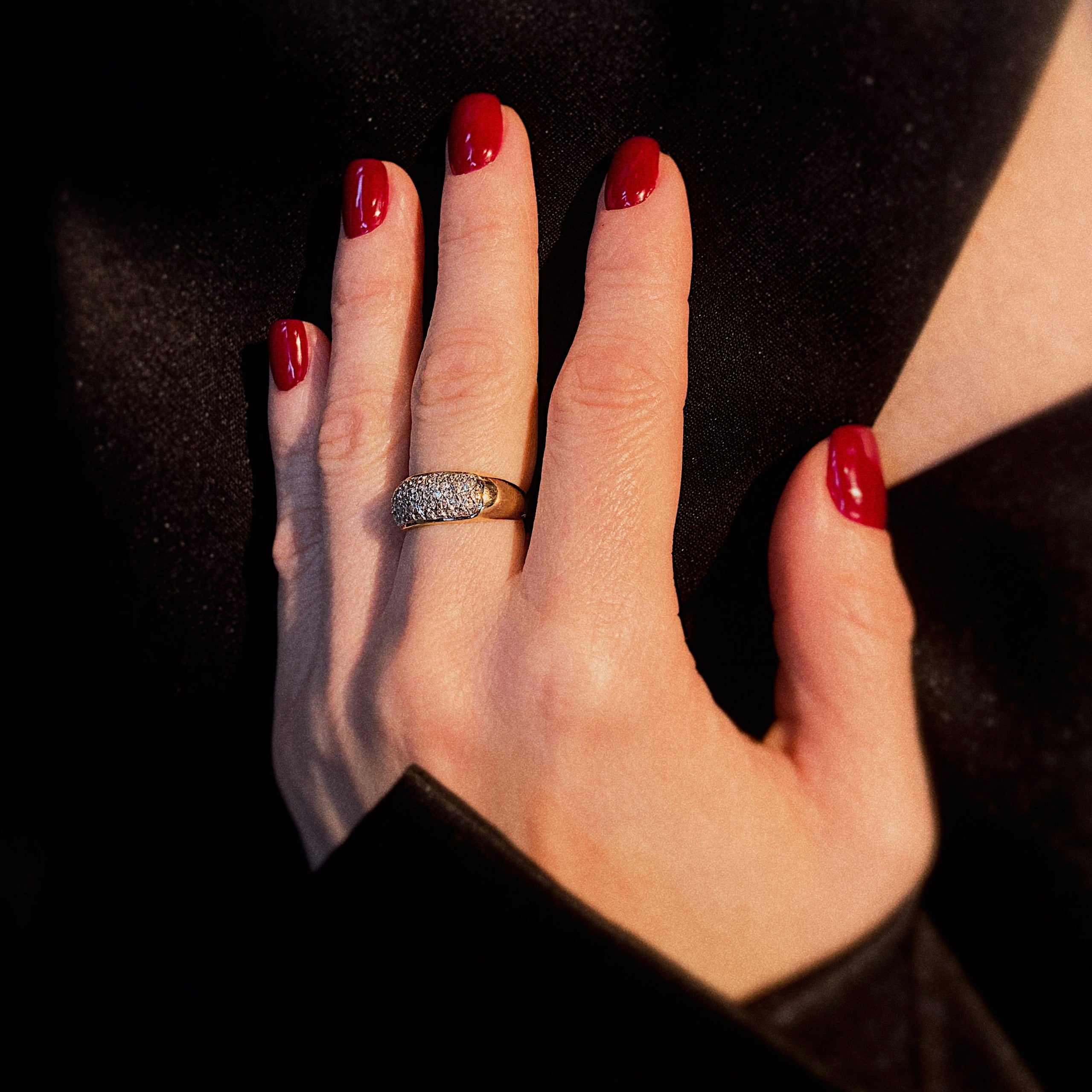 Model wearing the vintage gold ring with pave-set diamonds.