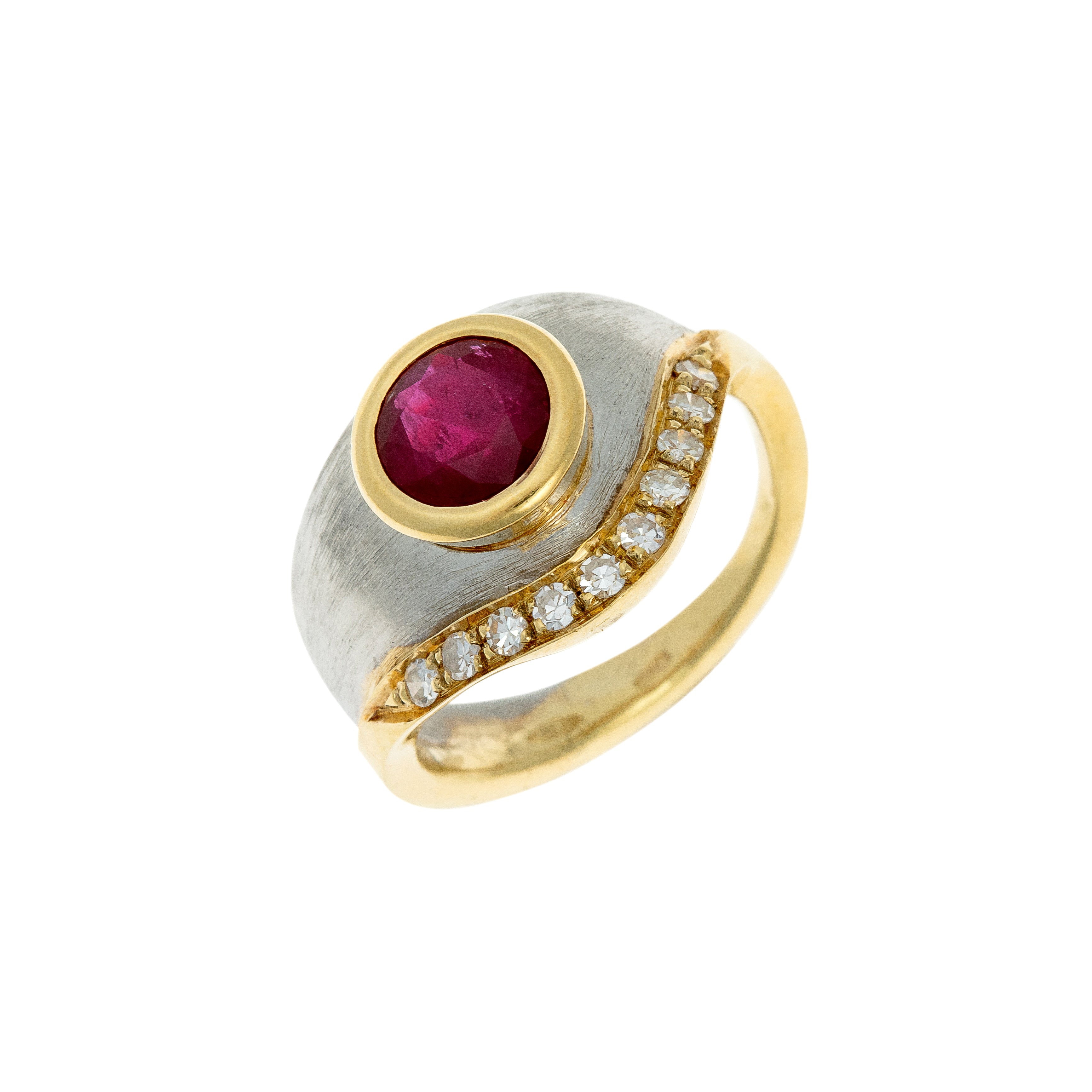 Late 20th-century statement ring featuring a 1.74 ct ruby and wave-set diamonds in platinum and gold.