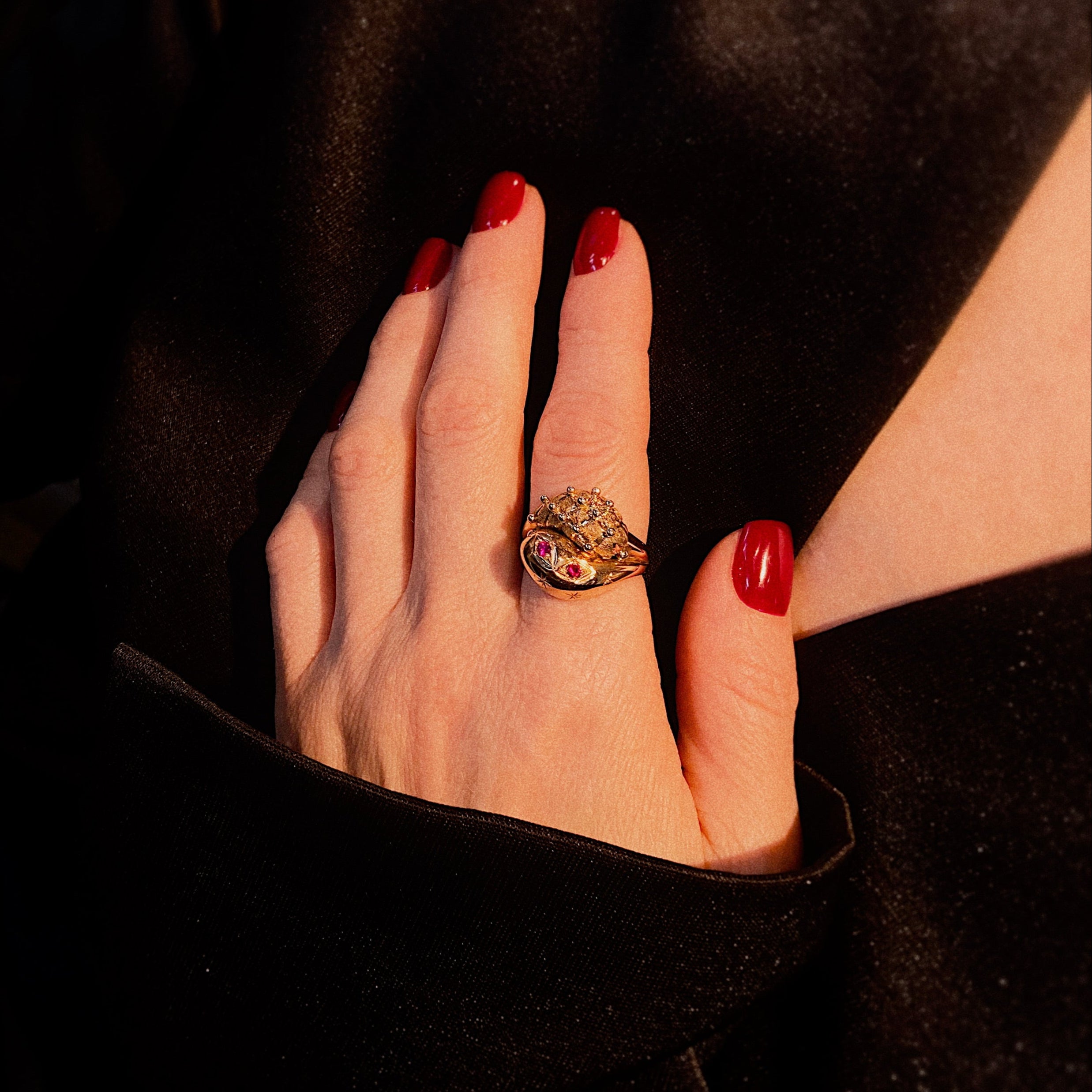 Model wearing the vintage gold snake cocktail ring with lab-grown rubies.