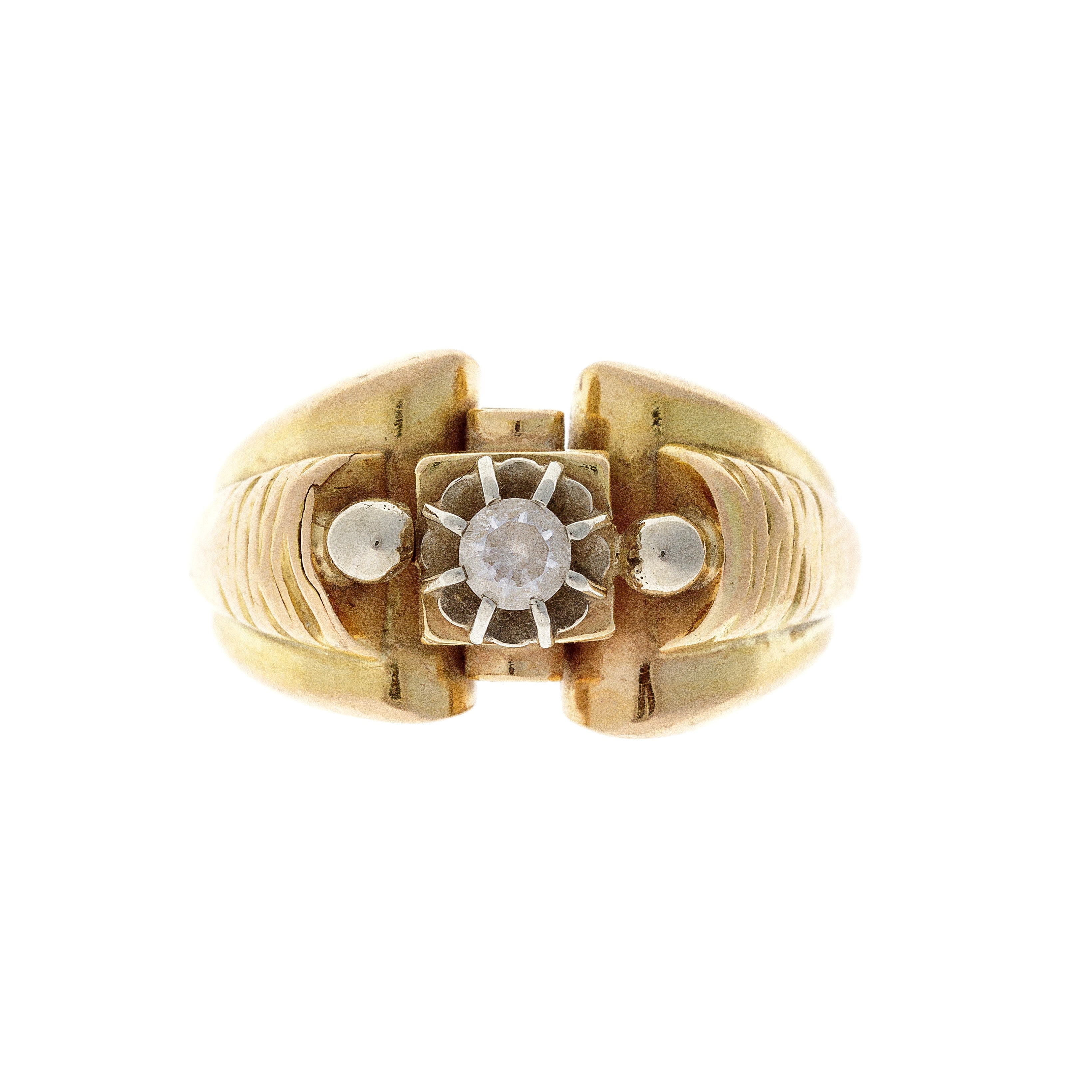 A vintage 18K gold tank ring featuring a bold Art Deco design with geometric patterns and a cubic zirconia centerpiece.