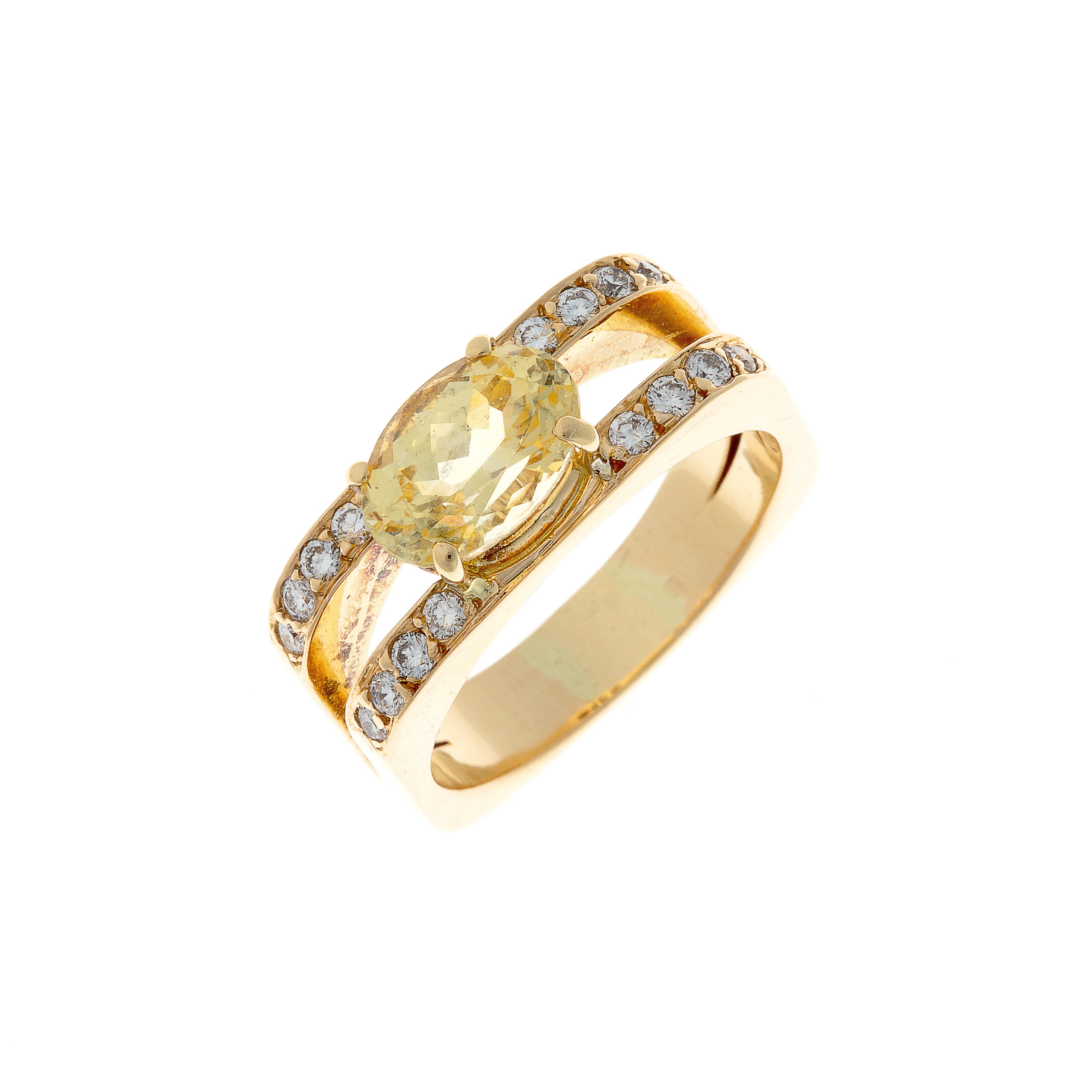 Angled view of vintage yellow gold ring showcasing radiant sapphire and pave-set diamond shoulders.