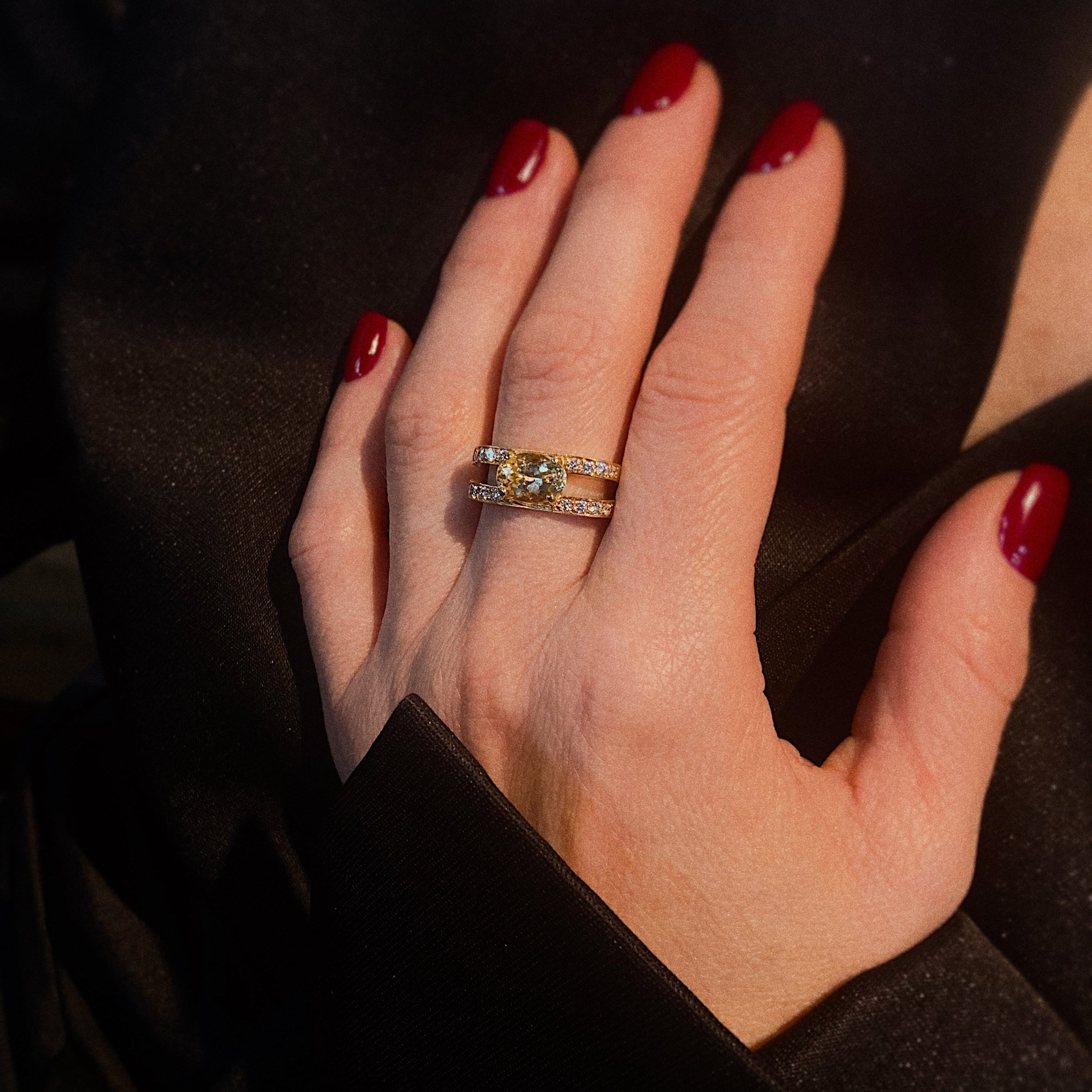 Model wearing the vintage gold cocktail ring with yellow sapphire and diamonds.