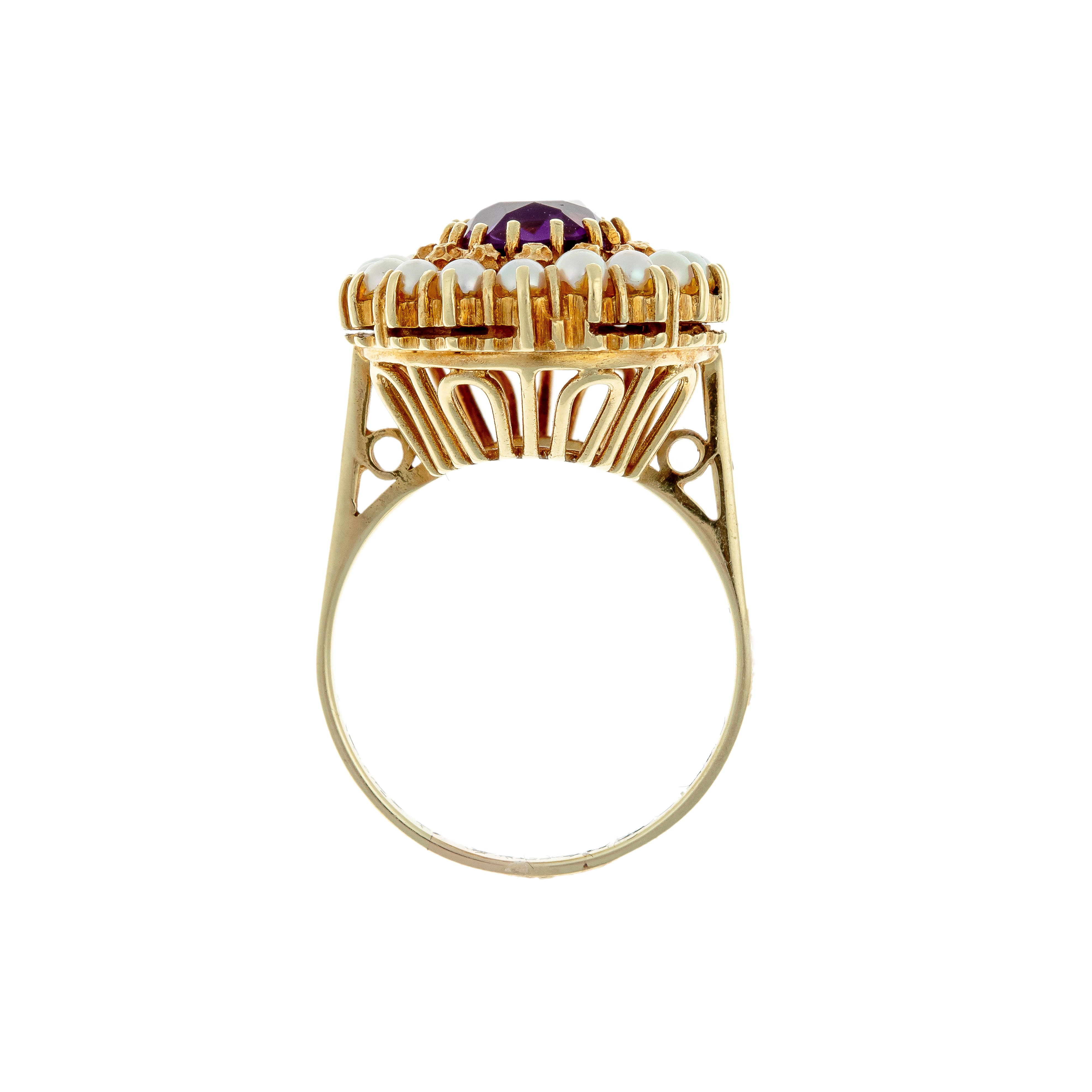 Profile view showing sculptural gallery of 1960s style amethyst cocktail ring.