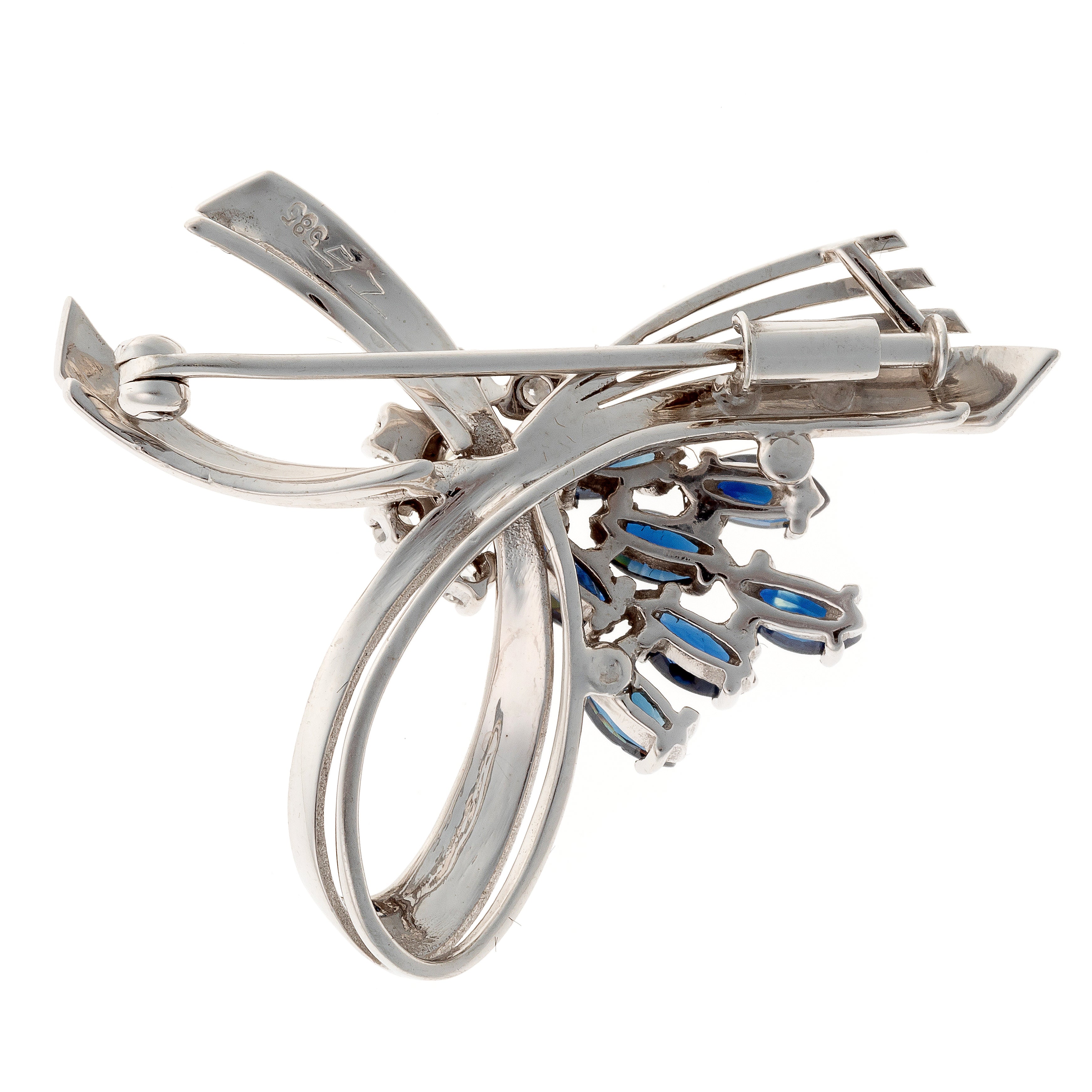 Back view of the sculptural white gold brooch with sapphires and diamonds, mid-century design.