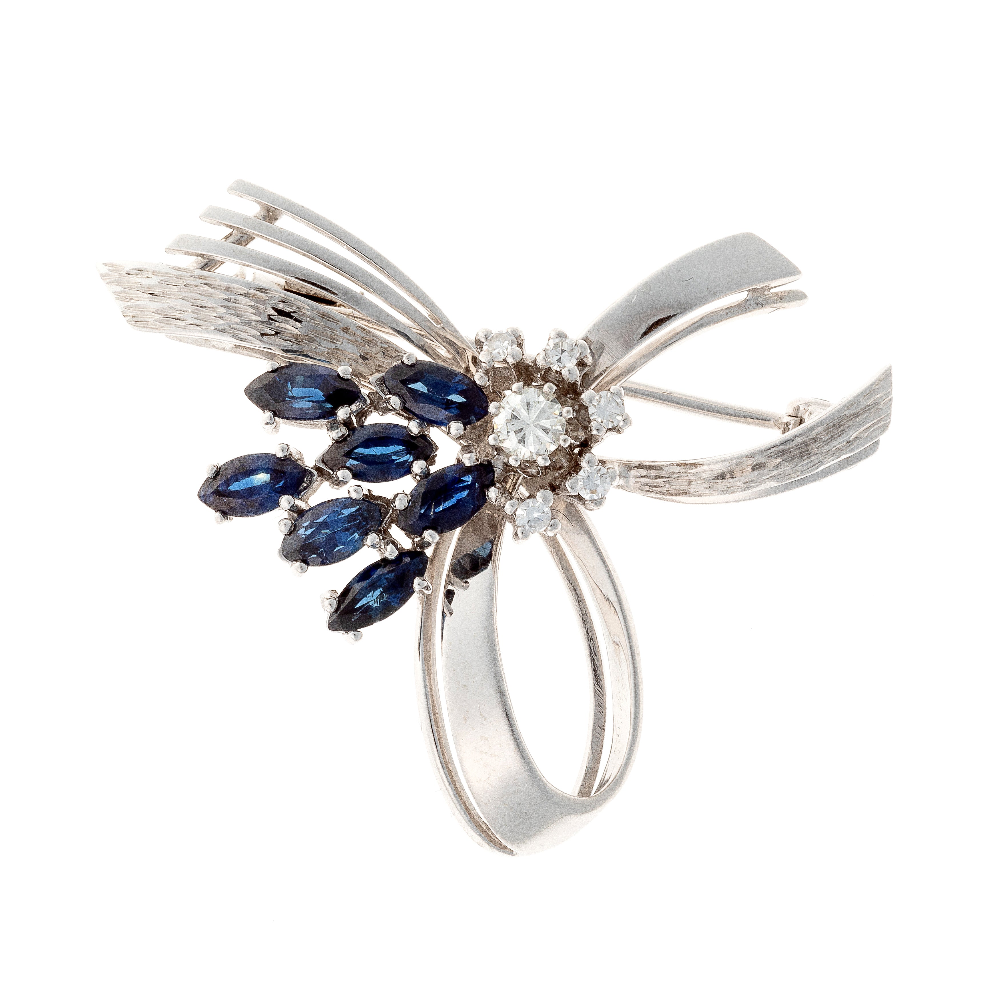 Mid-century white gold brooch with marquise sapphires and diamonds in ribbon design.